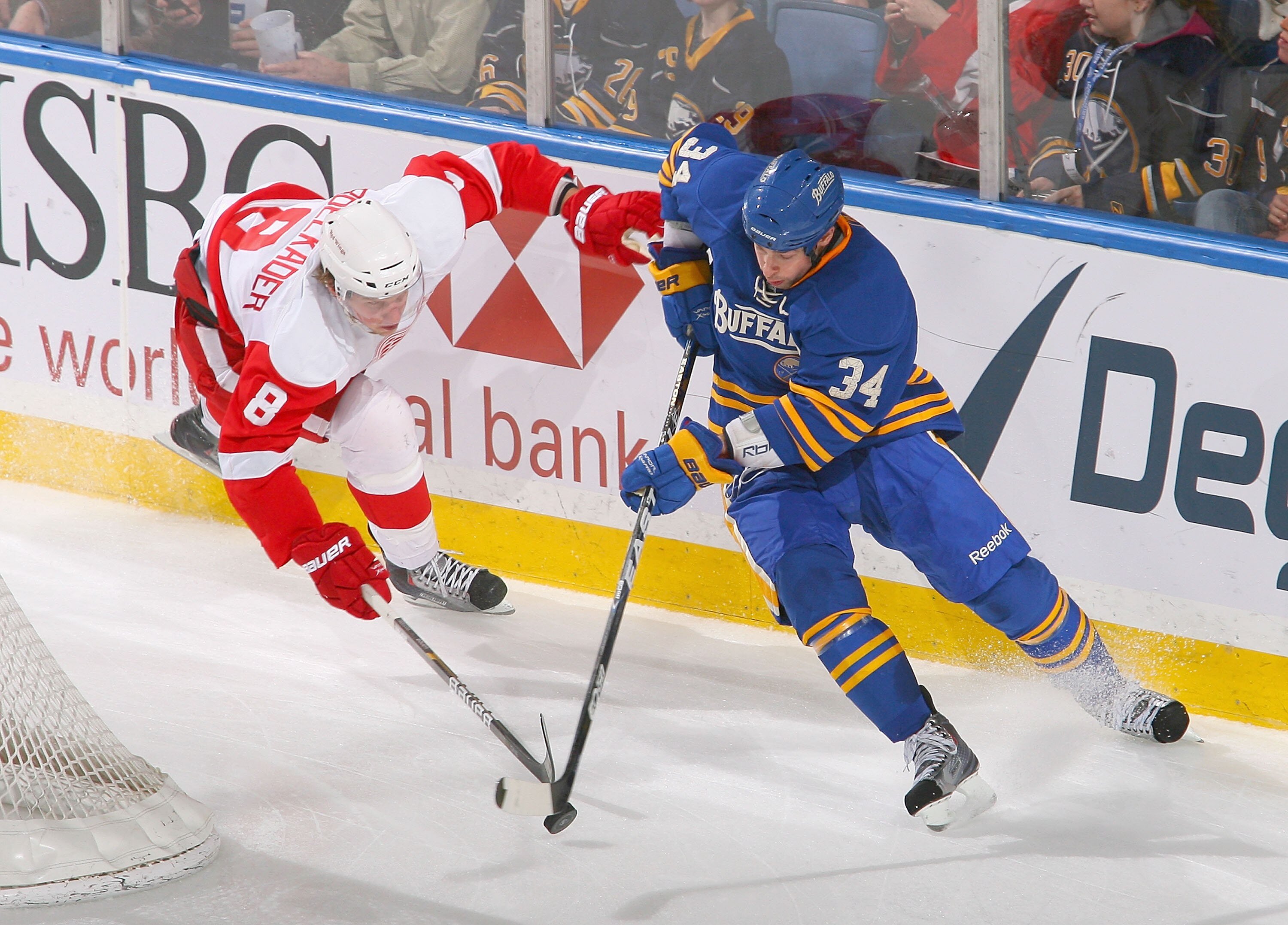 BUFFALO, NY - FEBRUARY 26: Chris Butler #34 of the Buffalo Sabres skates against Justin Abdelkader #8 of the Detroit Red Wings at HSBC Arena on February 26, 2011 in Buffalo, New York. Detroit won 3-2 in a shootout. (Photo by Rick Stewart/Getty Images) BUFFALO, NY - FEBRUARY 26: Chris Butler #34 of the Buffalo Sabres skates against Justin Abdelkader #8 of the Detroit Red Wings at HSBC Arena on February 26, 2011 in Buffalo, New York. Detroit won 3-2 in a shootout. (Photo by Rick Stewart/Getty Images)