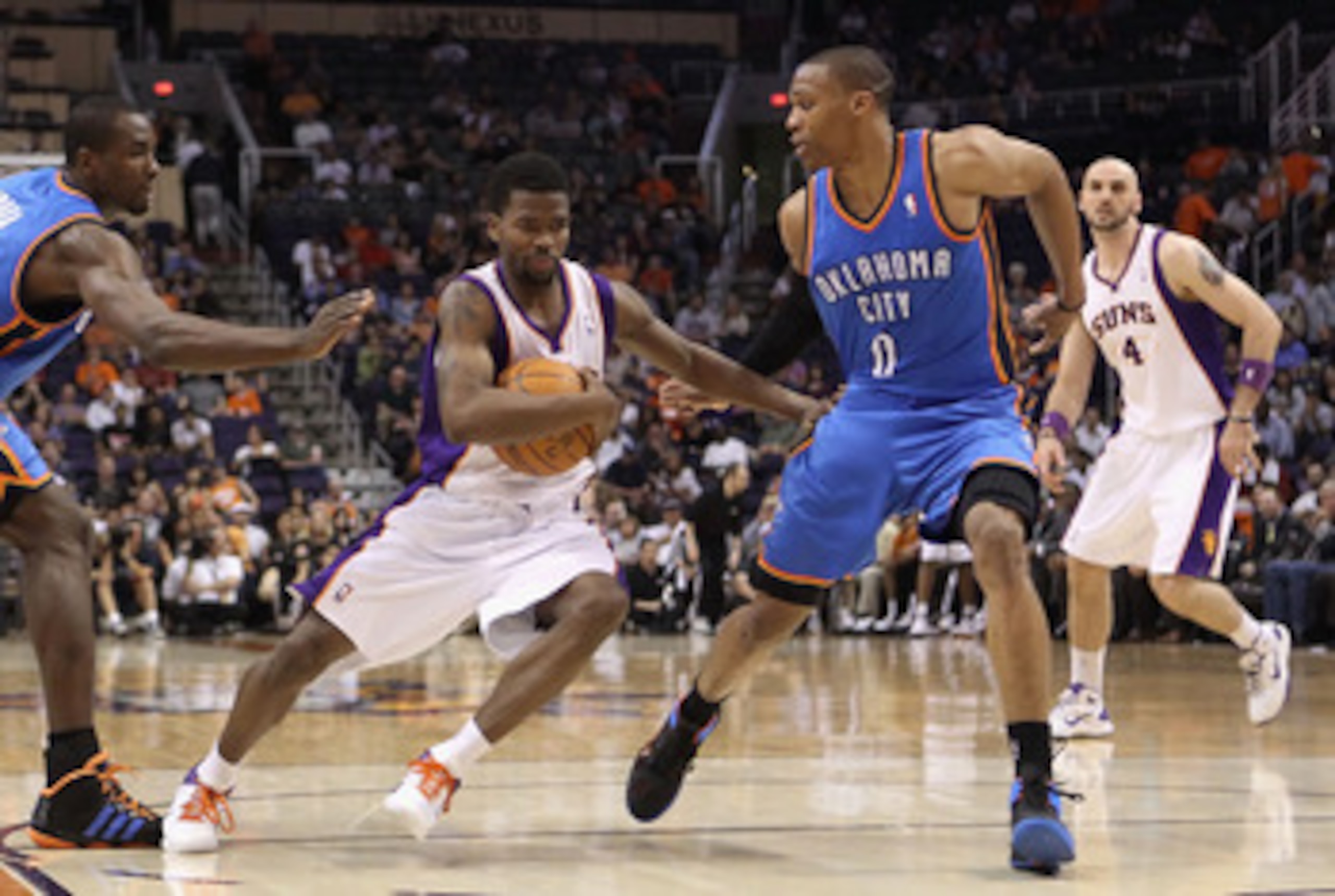 PHOENIX, AZ - MARCH 30:  Aaron Brooks #0 of the Phoenix Suns drives the ball past Russell Westbrook #0 of the Oklahoma City Thunder during the NBA game at US Airways Center on March 30, 2011 in Phoenix, Arizona.  The Thunder defeated the Suns 116-98. NOTE