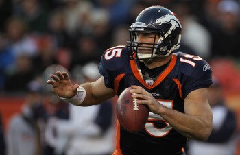 DENVER - DECEMBER 26:  Quarterback Tim Tebow #15 of the Denver Broncos rolls out and looks to deliver a pass against the Houston Texas at INVESCO Field at Mile High on December 26, 2010 in Denver, Colorado. The Broncos defeated the Texans 24-23.  (Photo b