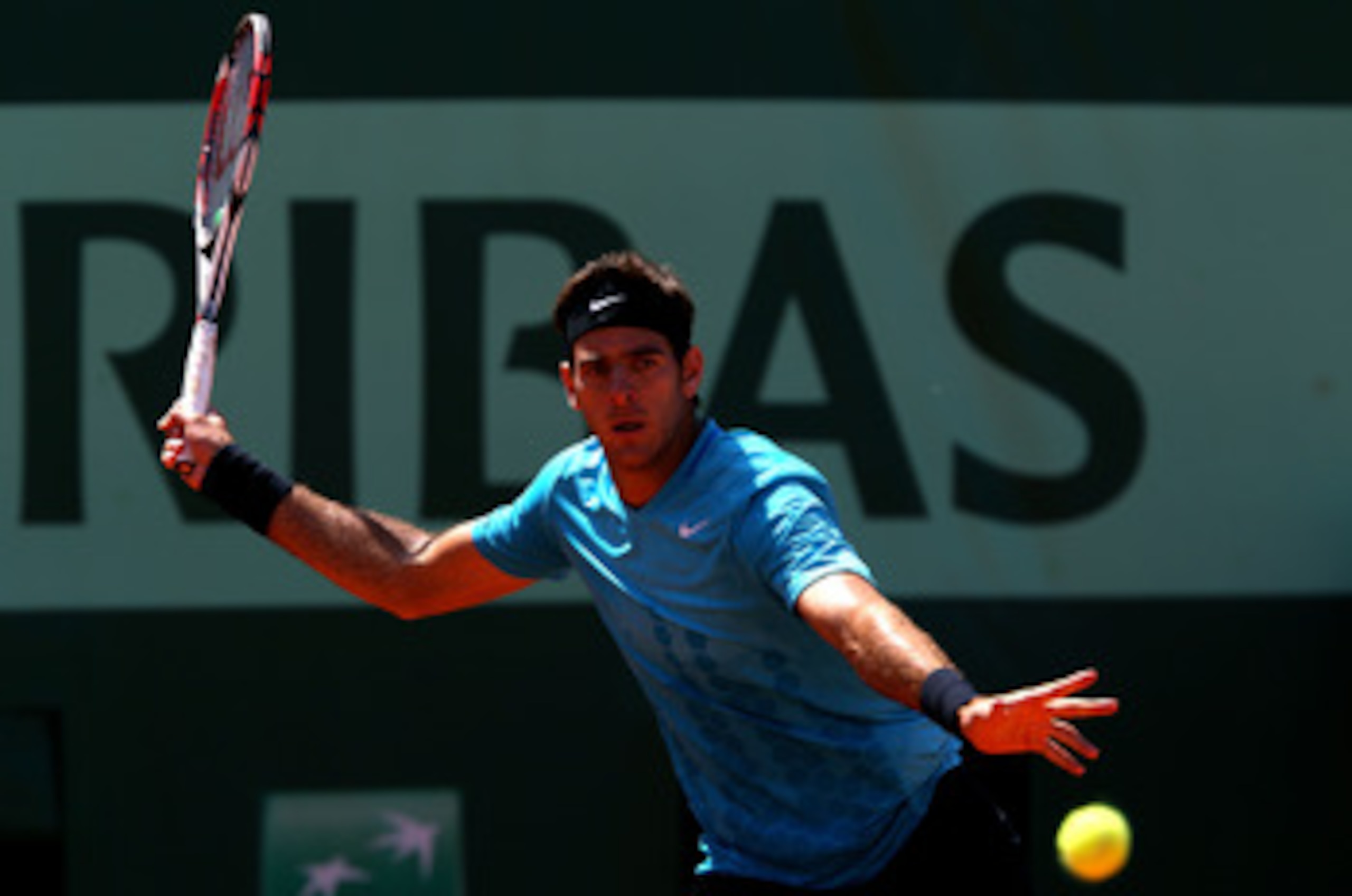 PARIS, FRANCE - MAY 23:  Juan Martin Del Potro of Argentina plays a forehand during the men's singles first round match between Juan Martin Del Potro of Argentina and Ivo Karlovic of Croatia on day two of the French Open at Roland Garros on May 23, 2011 i