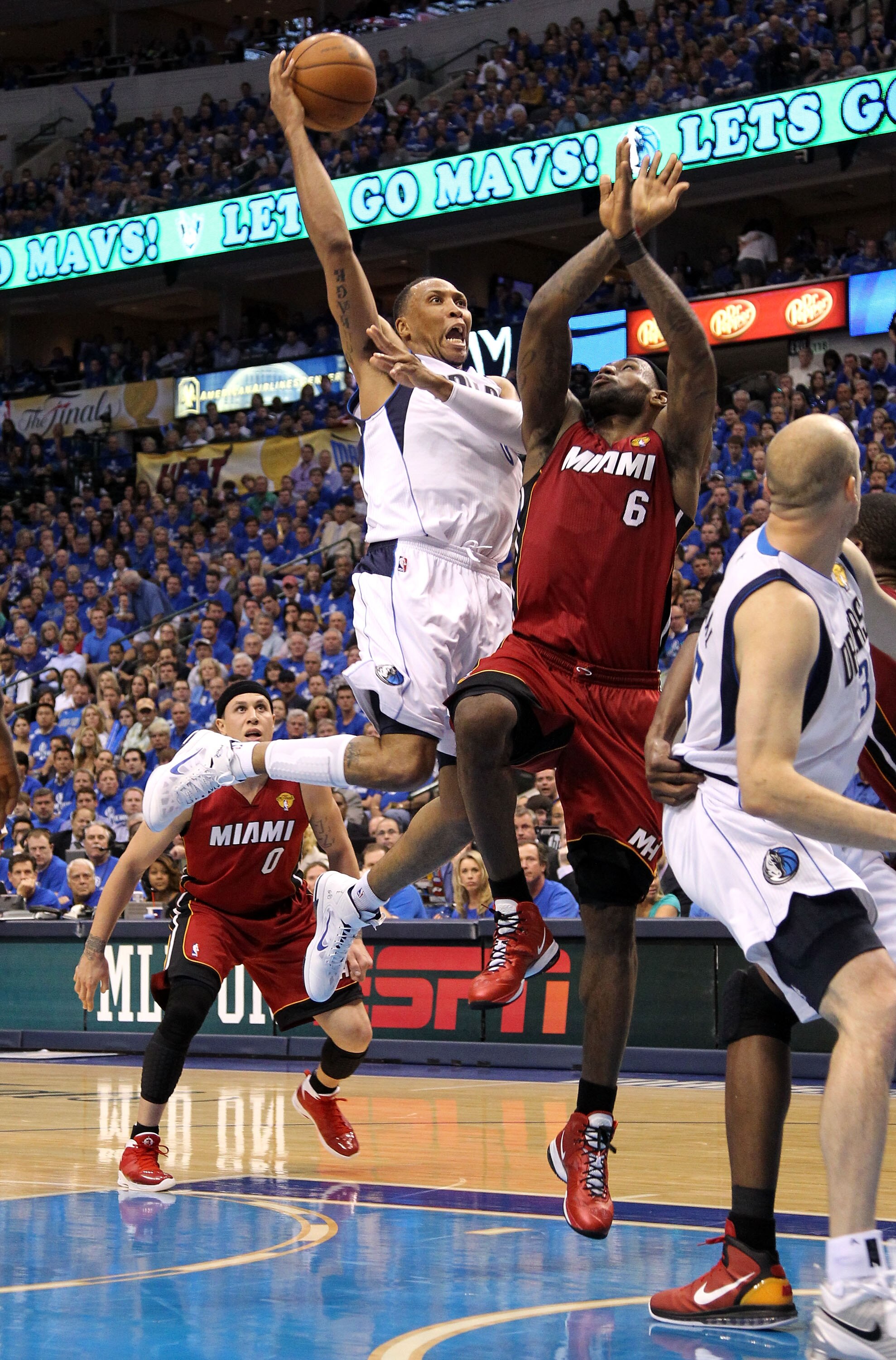 DALLAS, TX - JUNE 07:  Shawn Marion #0 of the Dallas Mavericks shoots over LeBron James #6 of the Miami Heat in the third quarter in Game Four of the 2011 NBA Finals at American Airlines Center on June 7, 2011 in Dallas, Texas. NOTE TO USER: User expressl