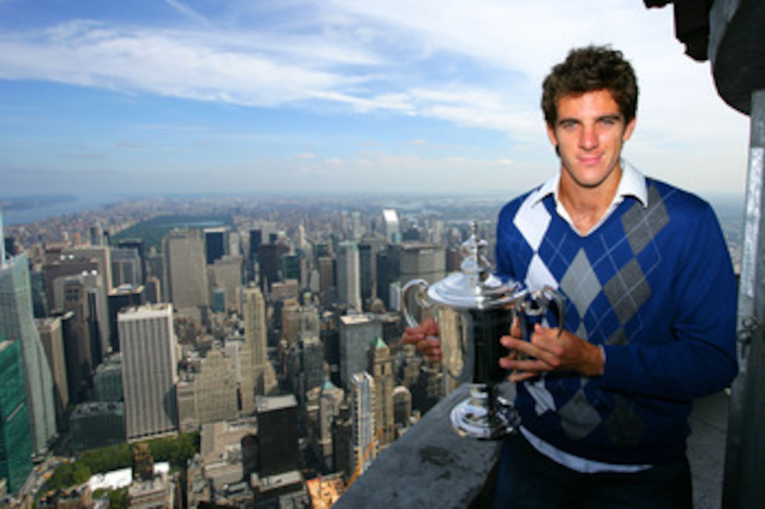 NEW YORK - SEPTEMBER 15: Juan Martin Del Potro the 2009 US Open Tennis Champion poses with the US Open trophy on a viewing deck at the Empire State Building on September 15, 2009 in New York City.  (Photo by Chris Trotman/Getty Images for ATP Tour)