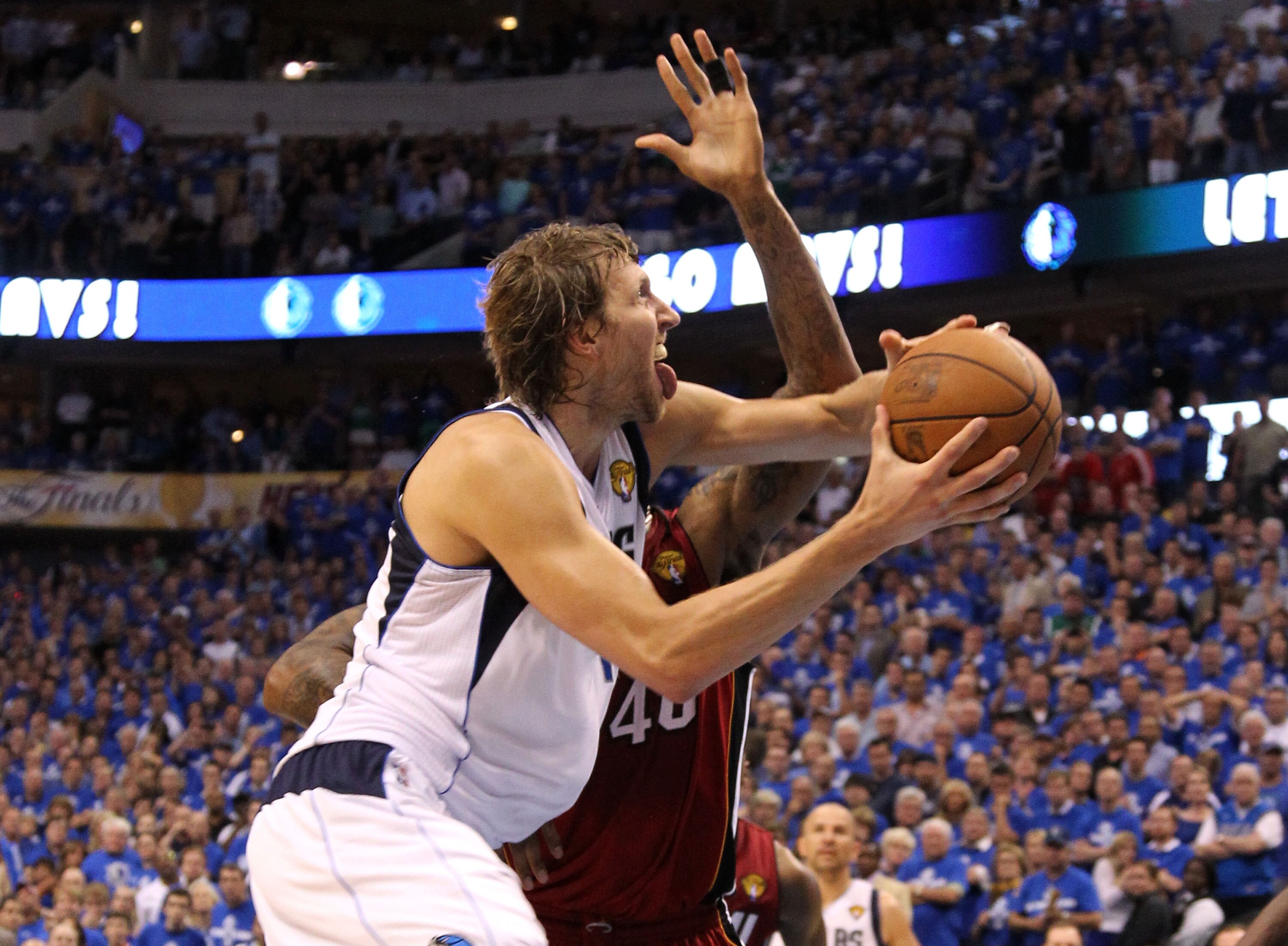 DALLAS, TX - JUNE 07:  Dirk Nowitzki #41 of the Dallas Mavericks goes up for a shot against Udonis Haslem #40 of the Miami Heat with .14 seconds remaining and scores to put the Mavericsk up 86-83 in the fourth quarter in Game Four of the 2011 NBA Finals a