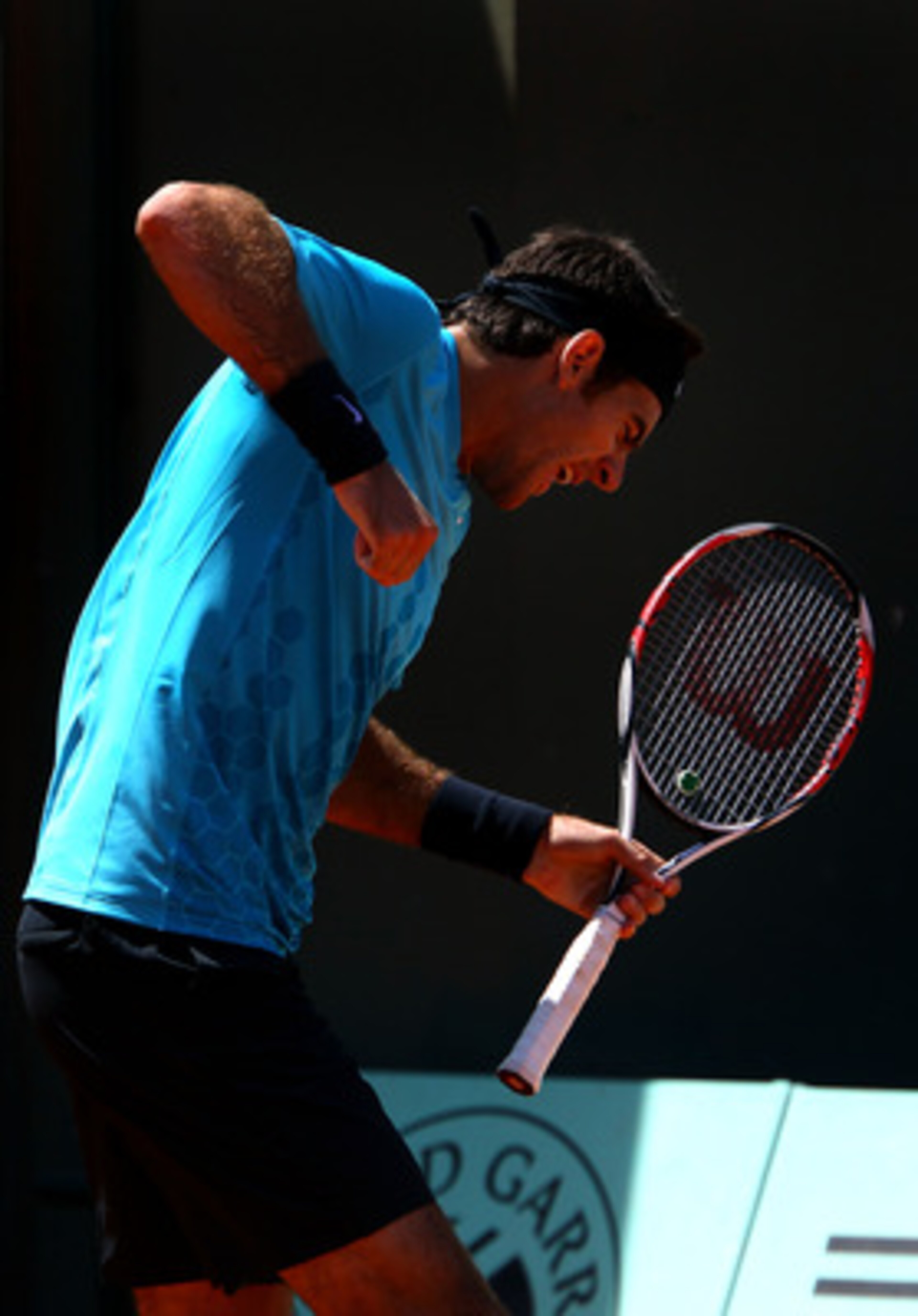 PARIS, FRANCE - MAY 23:  Juan Martin Del Potro of Argentina celebrates a point during the men's singles first round match between Juan Martin Del Potro of Argentina and Ivo Karlovic of Croatia on day two of the French Open at Roland Garros on May 23, 2011