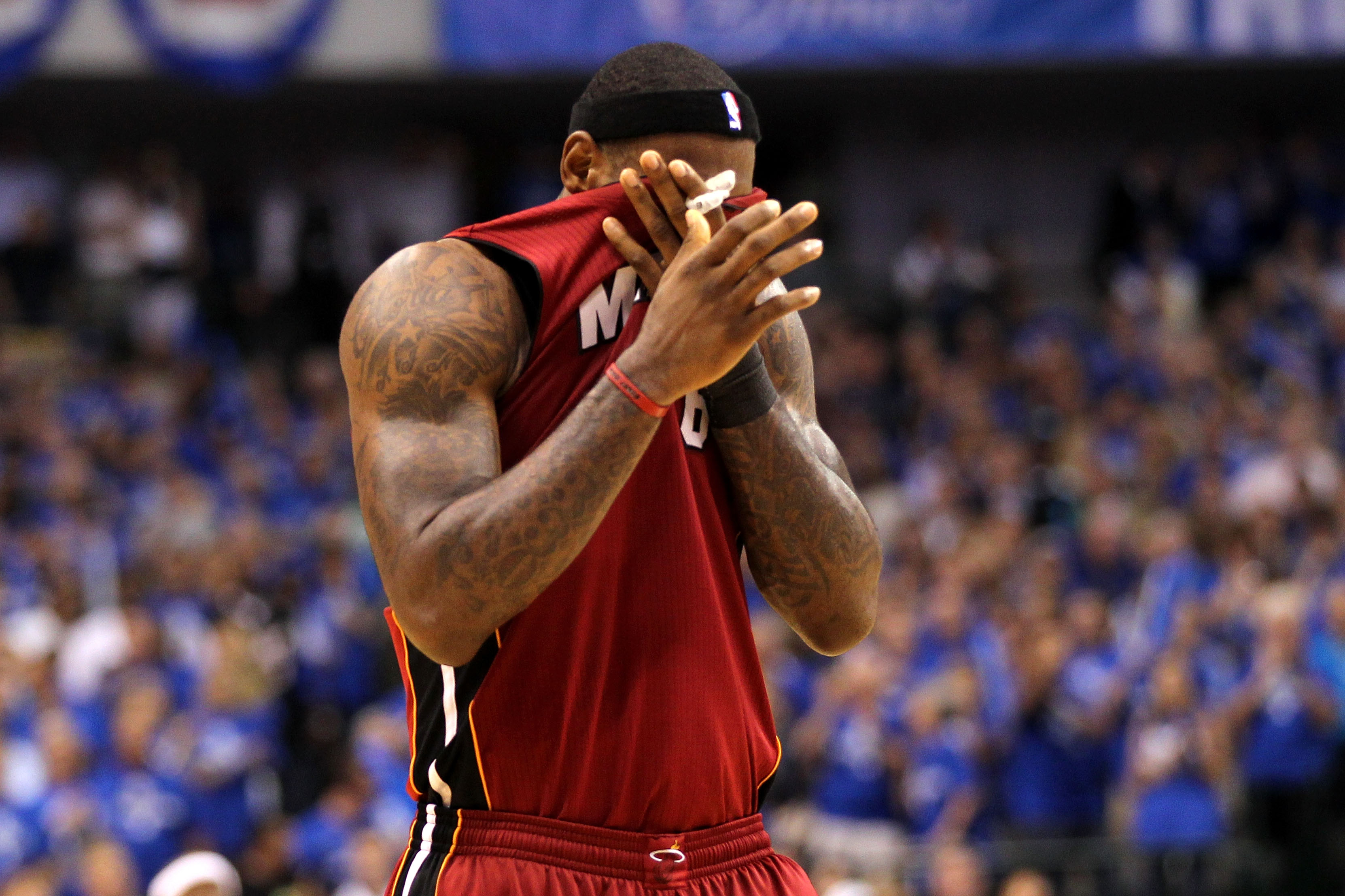 DALLAS, TX - JUNE 07:  LeBron James #6 of the Miami Heat wipes his face with his jersey against the Dallas Mavericks in Game Four of the 2011 NBA Finals at American Airlines Center on June 7, 2011 in Dallas, Texas. NOTE TO USER: User expressly acknowledge
