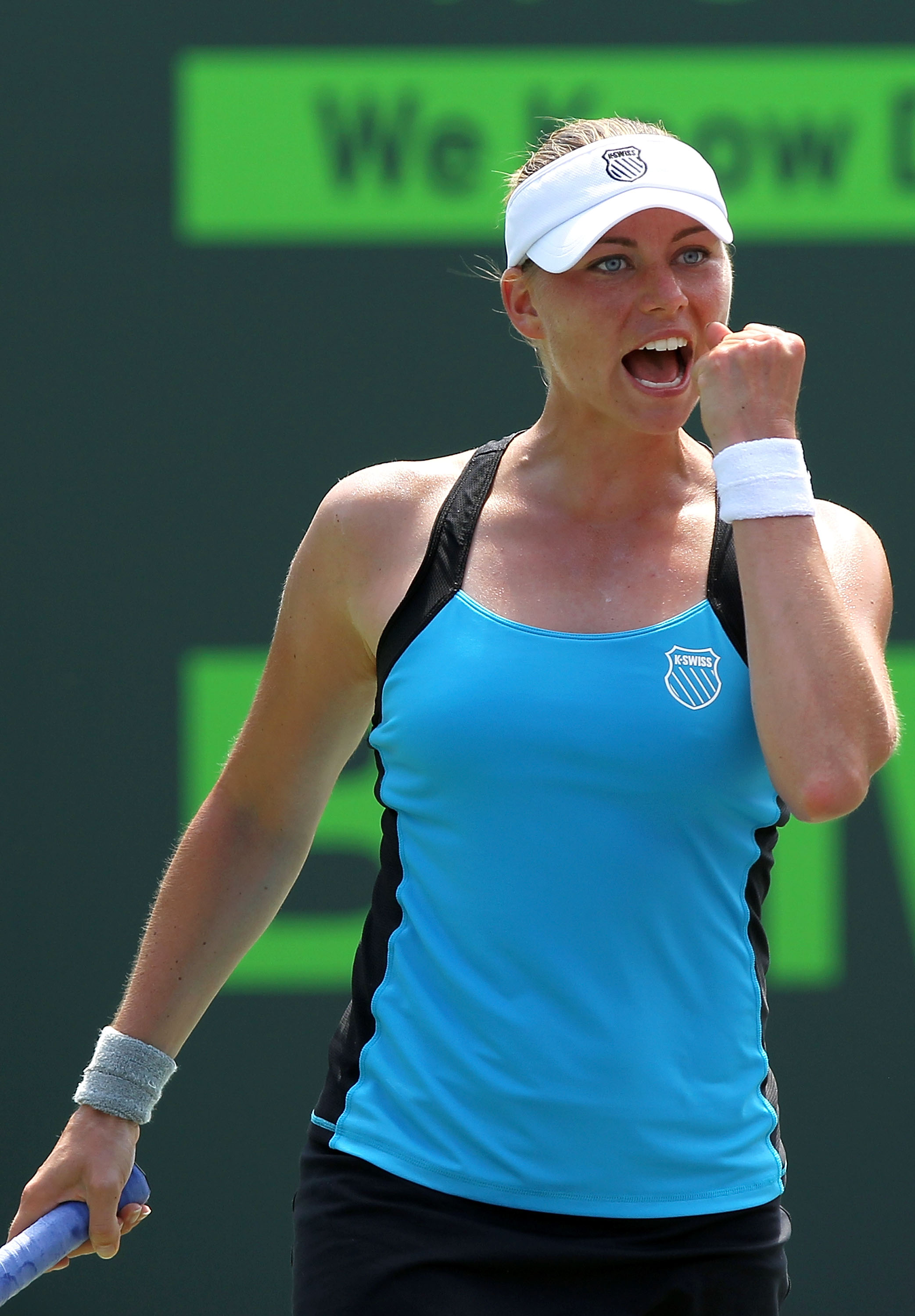 KEY BISCAYNE, FL - MARCH 30:  Vera Zvonareva of Russia celebrates after she won match point against Agnieszka Radwanska of Poland during the Sony Ericsson Open at Crandon Park Tennis Center on March 30, 2011 in Key Biscayne, Florida.  (Photo by Mike Ehrma