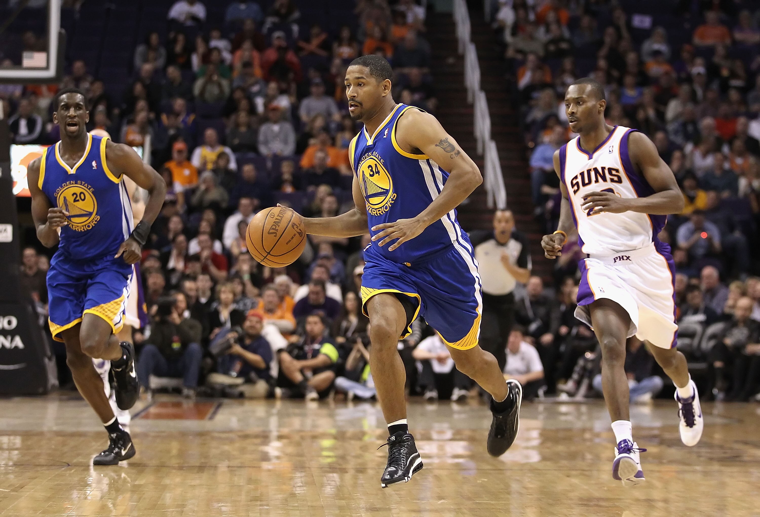 PHOENIX, AZ - FEBRUARY 10:  Charlie Bell #34 of the Golden State Warriors handles the ball during the NBA game against the Phoenix Suns at US Airways Center on February 10, 2011 in Phoenix, Arizona.  The Suns defeated the Warriors 112-88.  NOTE TO USER: U
