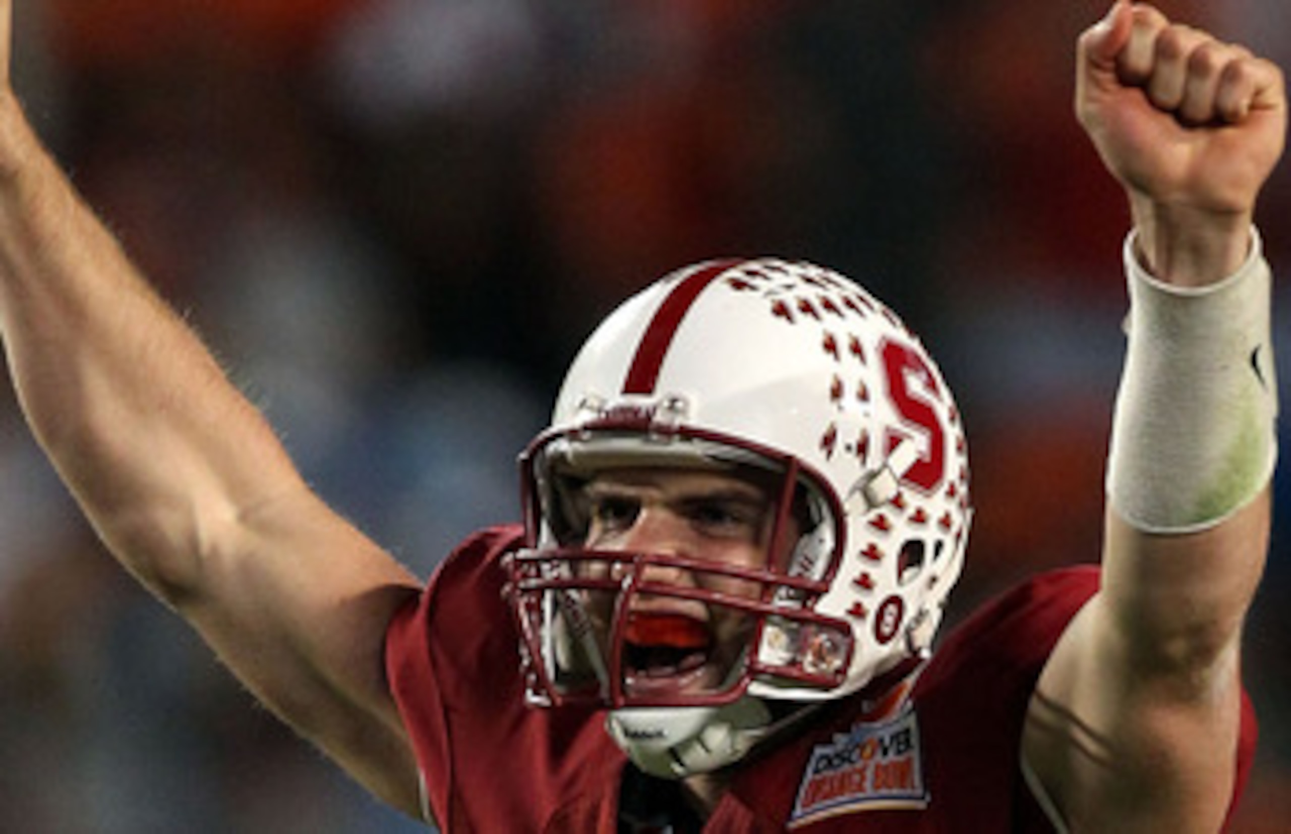 MIAMI, FL - JANUARY 03:  Andrew Luck #12 of the Stanford Cardinal celebrates after he threw a 38-yard touchdown pass in the fourth quarter against the Virginai Tech Hokies during the 2011 Discover Orange Bowl at Sun Life Stadium on January 3, 2011 in Miam