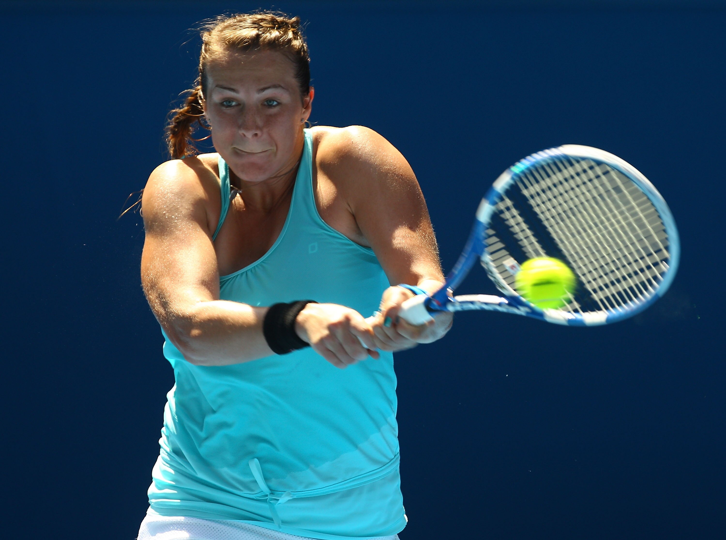 MELBOURNE, AUSTRALIA - JANUARY 22:  Anastasia Pavlyuchenkova of Russia plays a backhand in her third round match against Iveta Benesova of the Czech Republic during day six of the 2011 Australian Open at Melbourne Park on January 22, 2011 in Melbourne, Au