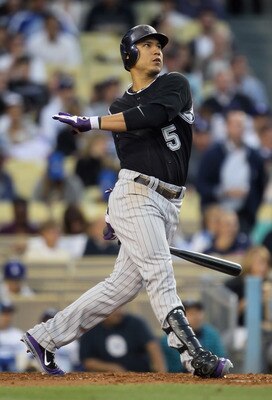 LOS ANGELES, CA - JUNE 01:  Carlos Gonzalez #5 of the Colorado Rockies hits a sacrifice fly in the third inning against the Los Angeles Dodgers at Dodger Stadium on June 1, 2011 in Los Angeles, California. The Rockies defeated the Dodgers 3-0.  (Photo by 
