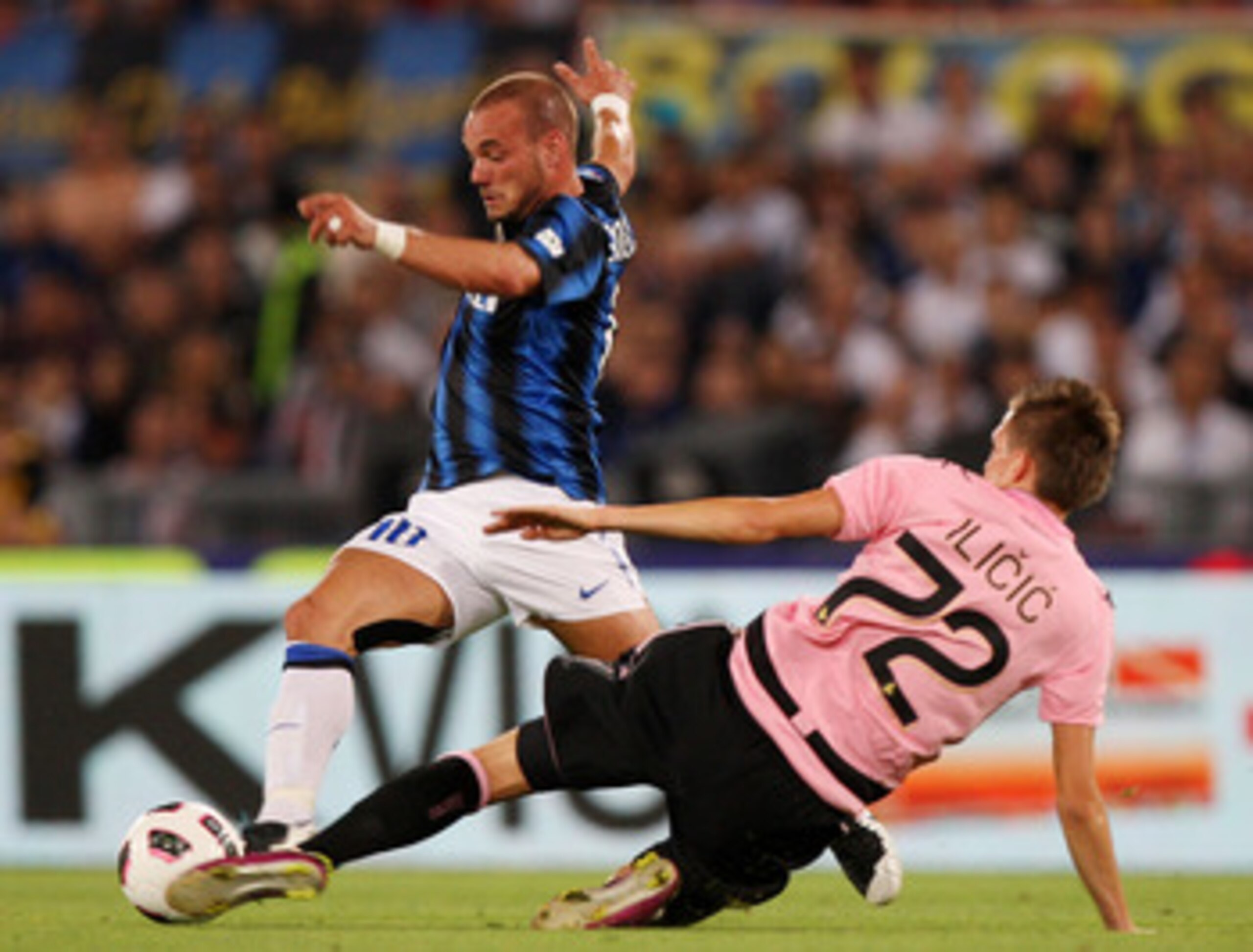 ROME, ITALY - MAY 29:  Wesley Sneider (L)  of FC Internazionale Milano competes for the ball with Josip Ilicic of US Citta di Palermo during the Tim Cup final between FC Internazionale Milano and US Citta di Palermo at Olimpico Stadium on May 29, 2011 in 