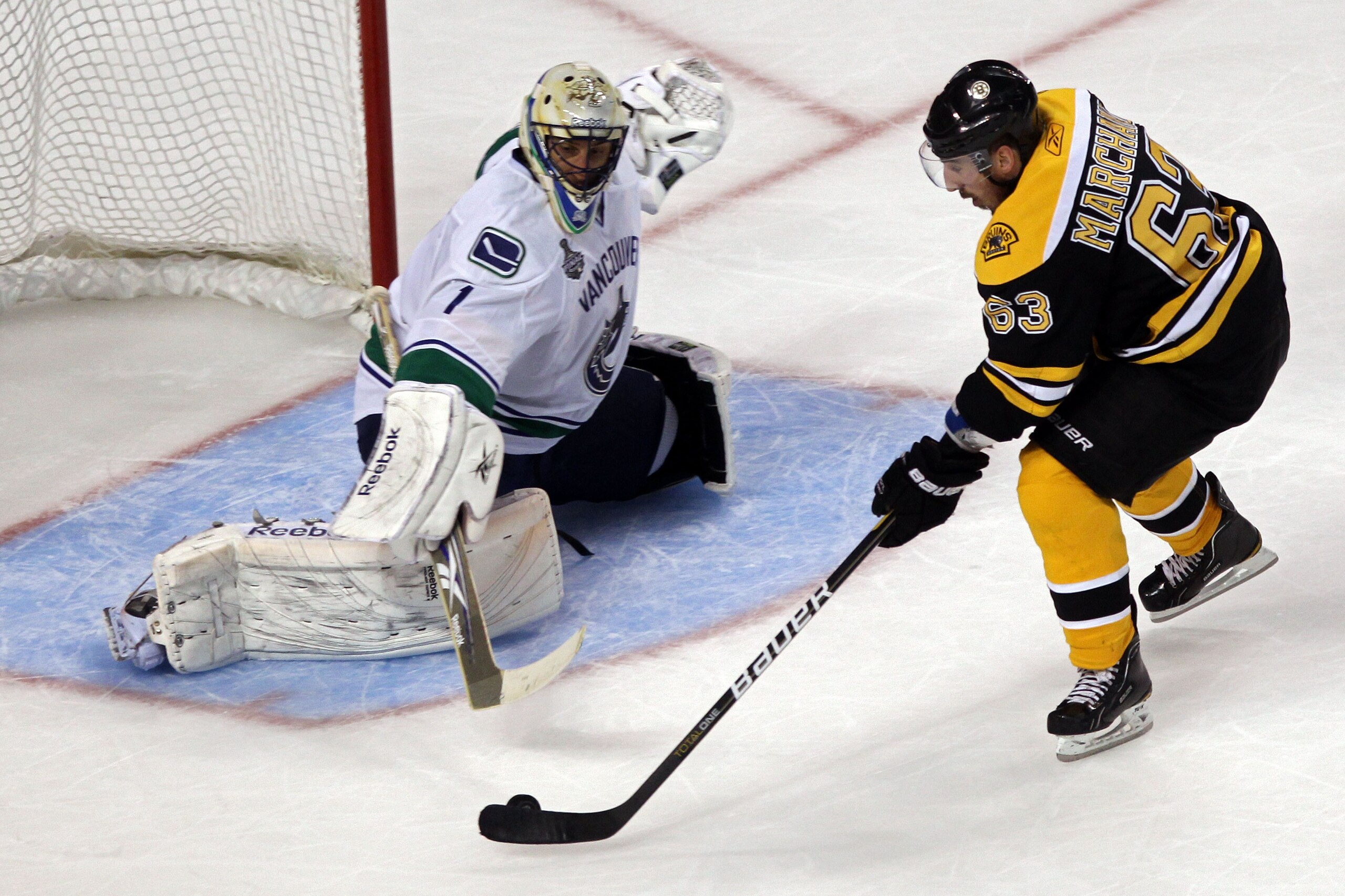 BOSTON, MA - JUNE 06:  Brad Marchand #63 of the Boston Bruins scores a goal in the second period against Roberto Luongo #1 of the Vancouver Canucks during Game Three of the 2011 NHL Stanley Cup Final at TD Garden on June 6, 2011 in Boston, Massachusetts.