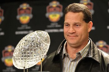 SCOTTSDALE, AZ - JANUARY 11:  Head coach Gene Chizik of the Auburn Tigers poses with the Coaches trophys during a press conference for the Tostitos BCS National Championship Game at the JW Marriott Camelback Inn on January 11, 2011 in Scottsdale, Arizona.