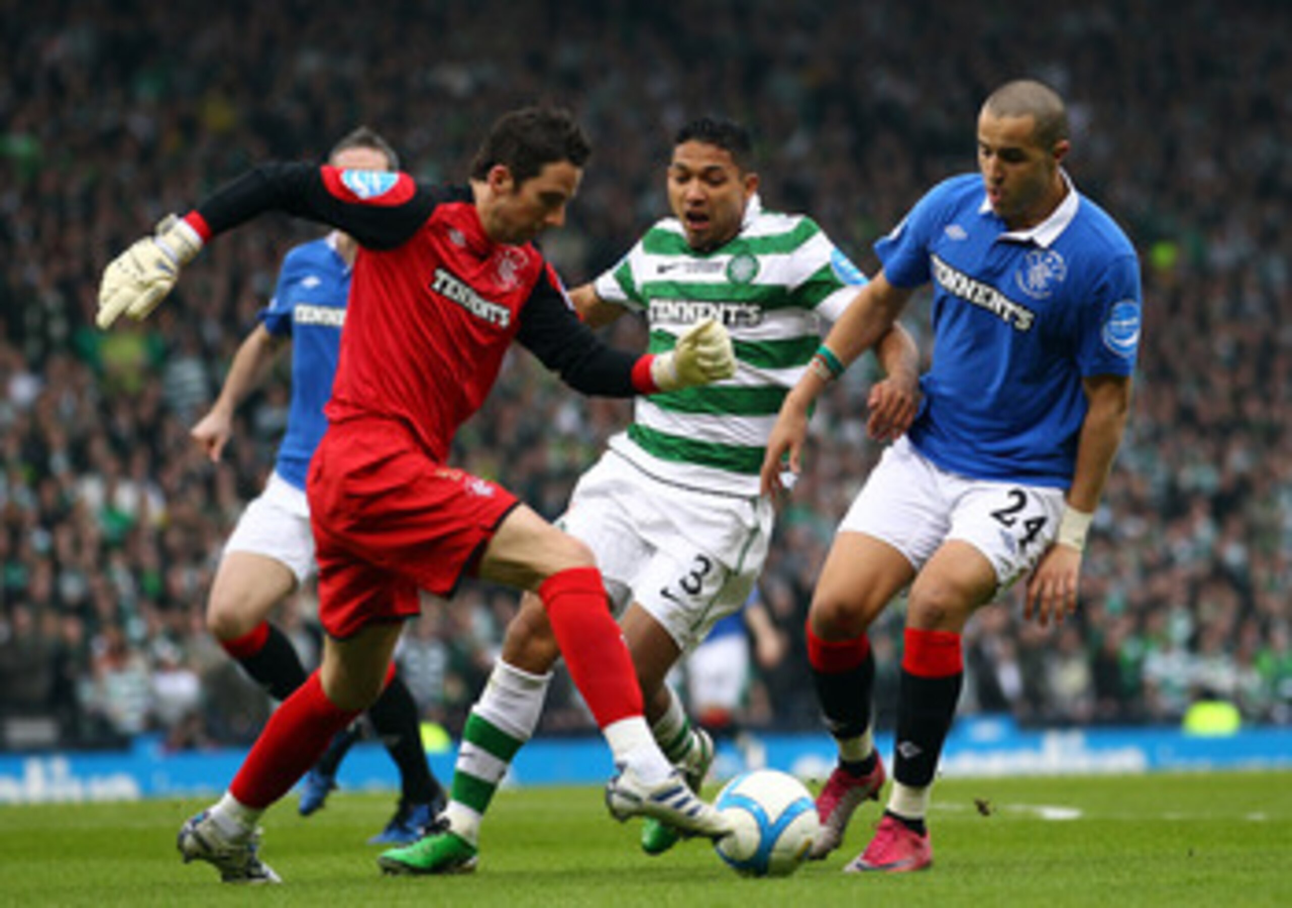GLASGOW, SCOTLAND - MARCH 20:  Goalkeeper, Neil Alexander of Rangers in action with Emilio Izaguirre of Celtic and Madjid Bougherra of Rangers during the Co-operative Insurance Cup final between Celtic and Rangers at Hampden Park on March 20, 2011 in Glas