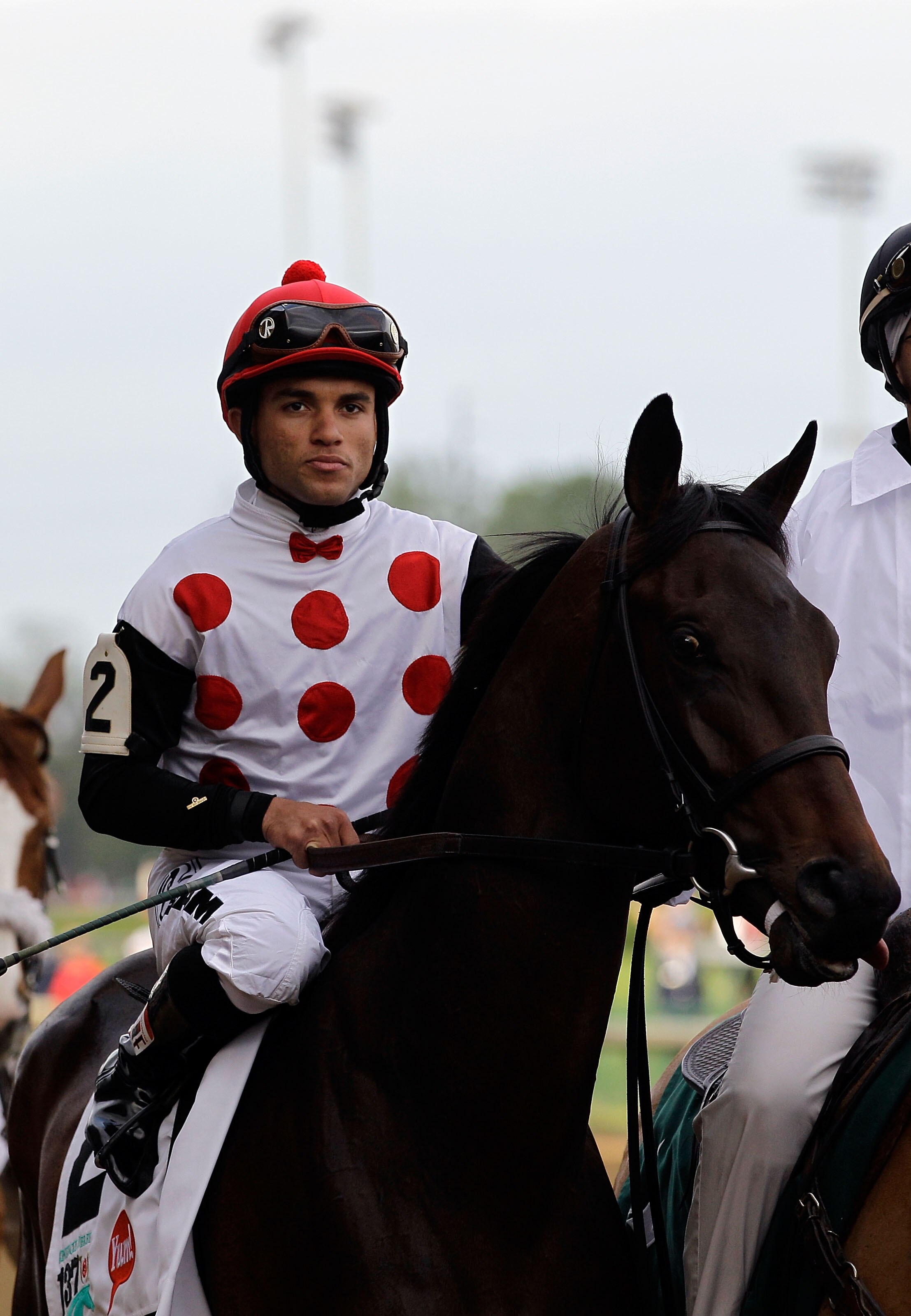 LOUISVILLE, KY - MAY 07:  Jockey Joel Rosario, riding Brilliant Speed #2, is escourted onto the track by an outrider for the running of the 137th Kentucky Derby at Churchill Downs on May 7, 2011 in Louisville, Kentucky.  (Photo by Rob Carr/Getty Images)