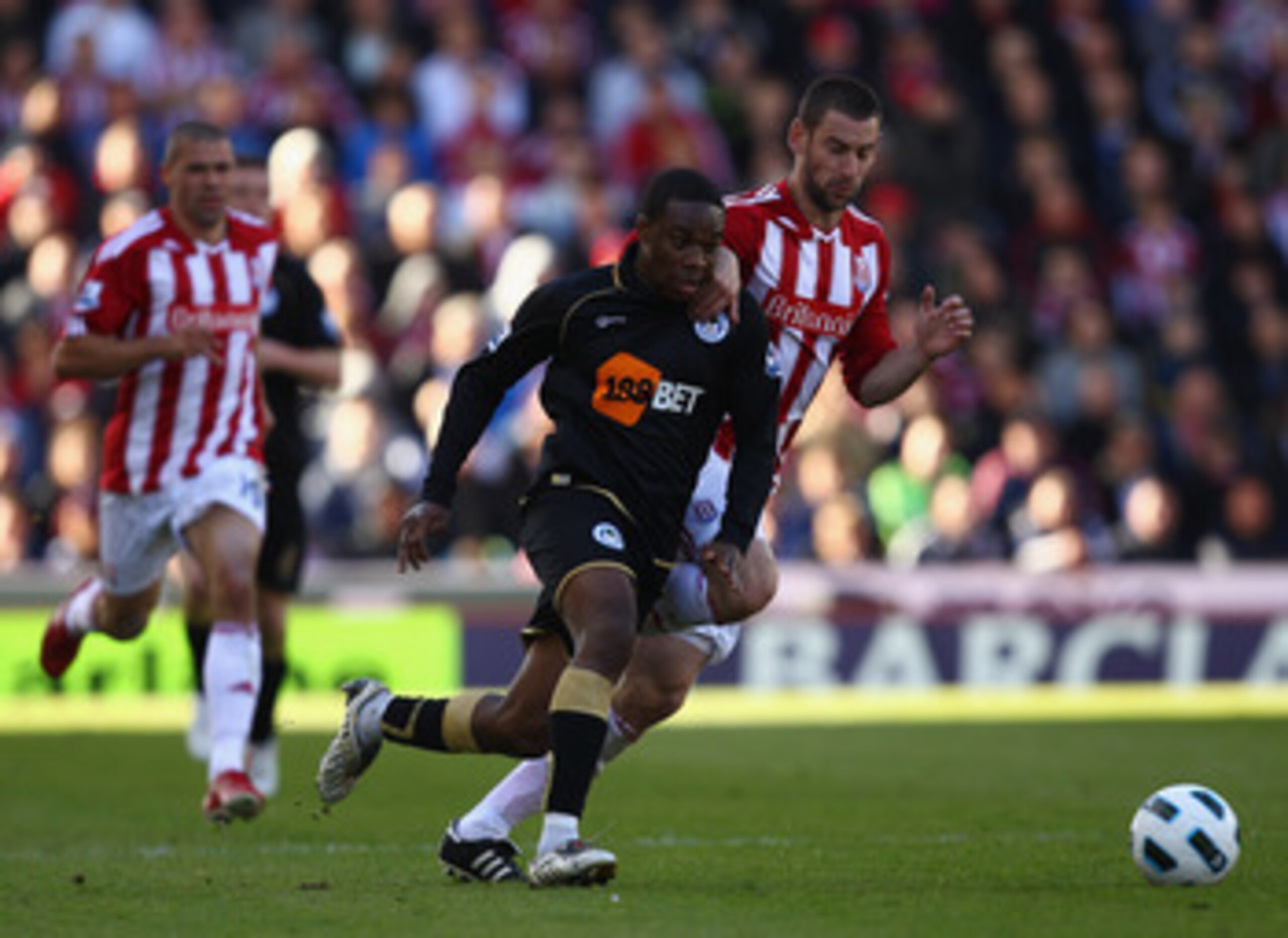 STOKE ON TRENT, ENGLAND - MAY 22:  Rory Delap of Stoke fights for the ball with Charles N'Zogbia of Wigan during the Barclays Premier League match between Stoke City and Wigan Athletic at Britannia Stadium on May 22, 2011 in Stoke on Trent, England.  (Pho