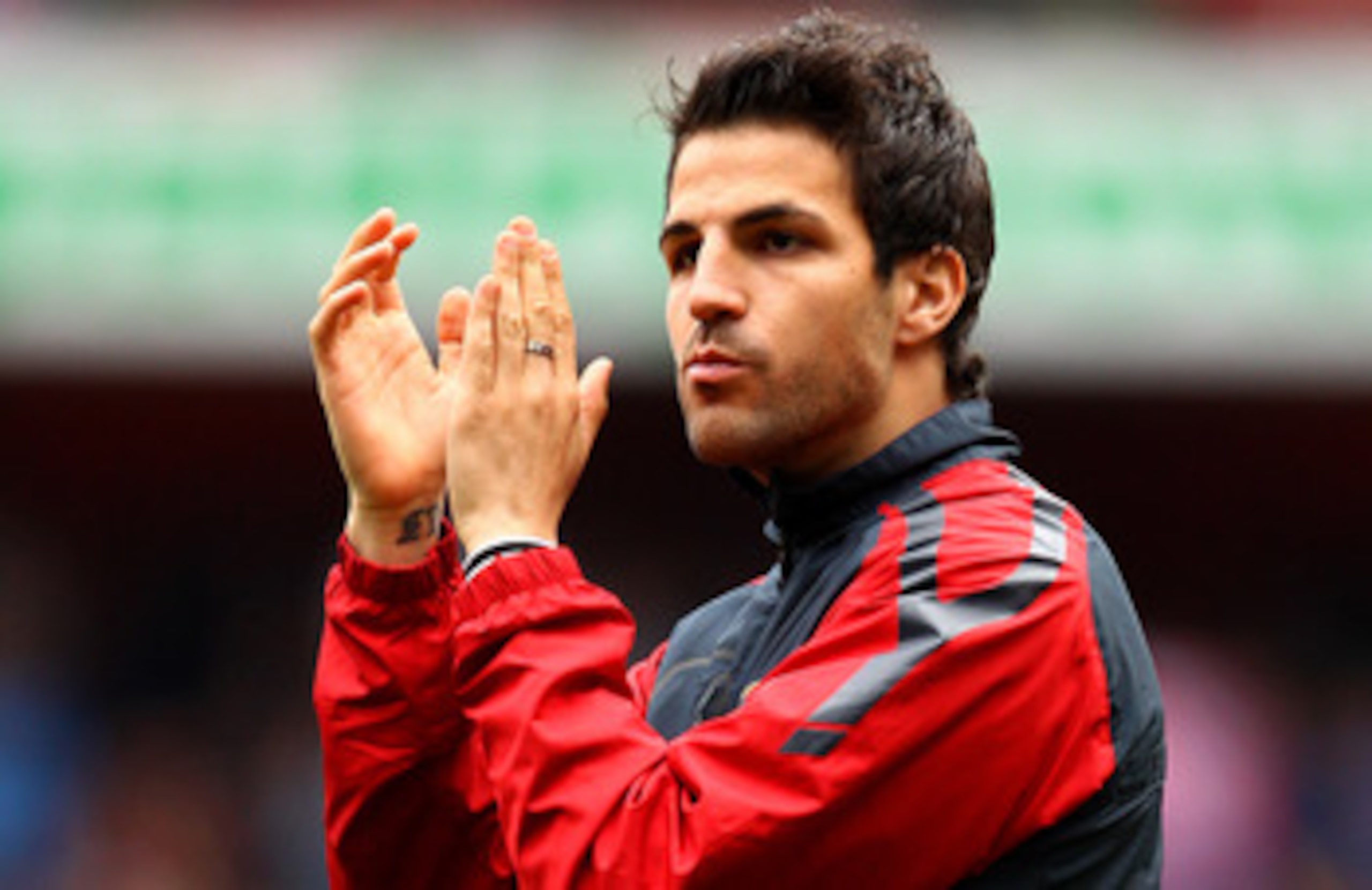 LONDON, ENGLAND - MAY 15:  Cesc Fabregas of Arsenal applauds the fans during a lap of honour after the Barclays Premier League match between Arsenal and Aston Villa at the Emirates Stadium on May 15, 2011 in London, England.  (Photo by Richard Heathcote/G