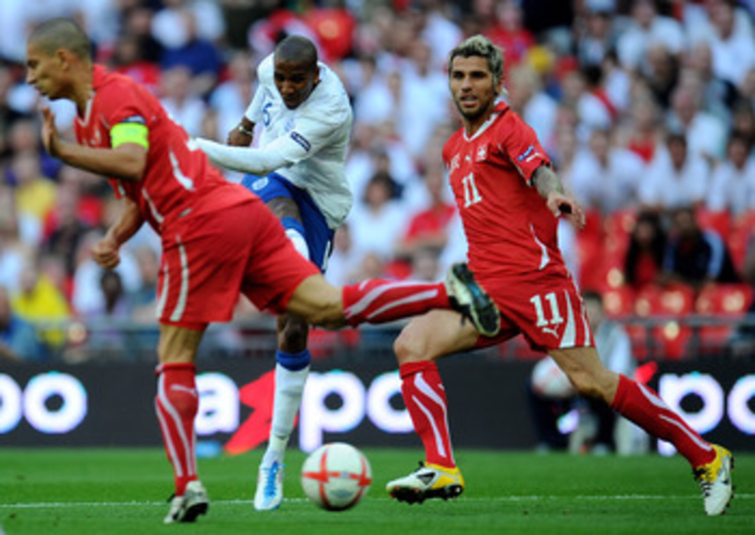 LONDON, ENGLAND - JUNE 04:  Ashley Young (C) of England shoots and scores their second equalising goal during the UEFA EURO 2012 group G qualifying match between England and Switzerland at Wembley Stadium on June 4, 2011 in London, England.  (Photo by Cli