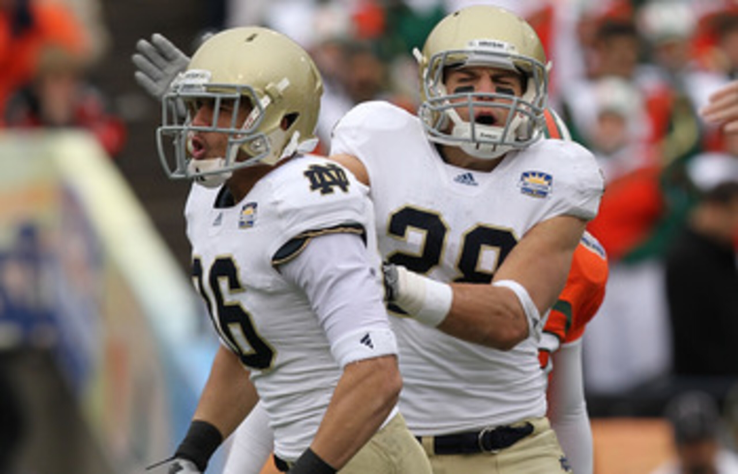 EL PASO, TX - DECEMBER 30:  (L-R) Bennett Jackson #86 and Austin Collinsworth #28 of the Notre Dame Fighting Irish celebrate a tackle against the Miami Hurricanes at Sun Bowl on December 30, 2010 in El Paso, Texas.  (Photo by Ronald Martinez/Getty Images)