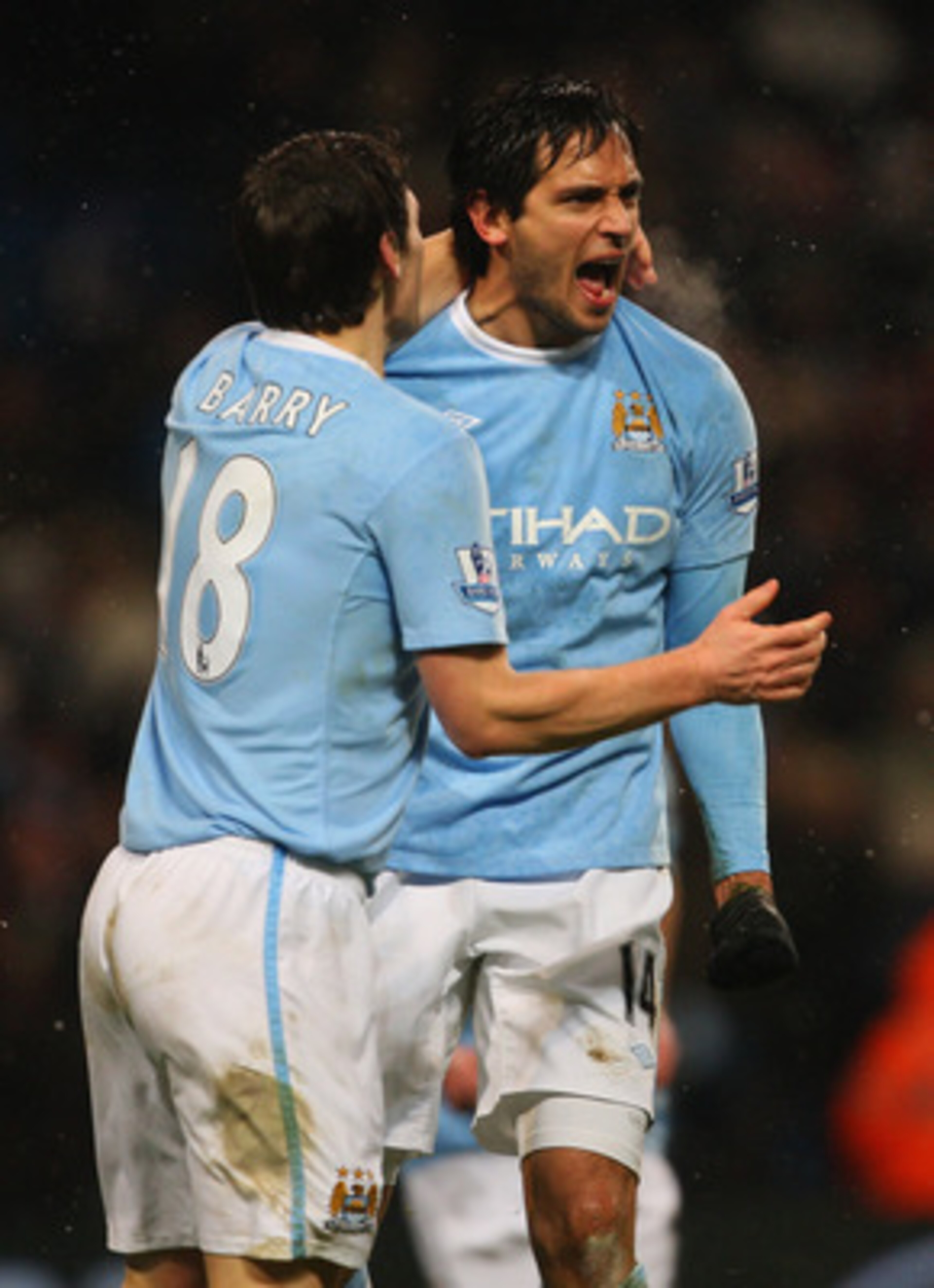 MANCHESTER, ENGLAND - DECEMBER 19:  Manchester City goalscorer Roque Santa Cruz (R) celebrates the winning goal with Gareth Barry during the Barclays Premier League game between Manchester City and Sunderland at City of Manchester Stadium on December 19, 