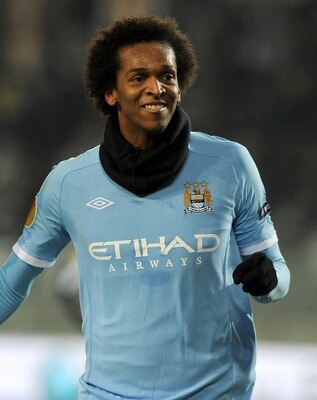 TURIN, ITALY - DECEMBER 16:  Jo ( R) of Manchester City celebrates after scoring City's equalising goal during the UEFA Europa League group A match between Juventus FC and Manchester City at Stadio Olimpico di Torino on December 16, 2010 in Turin, Italy. 