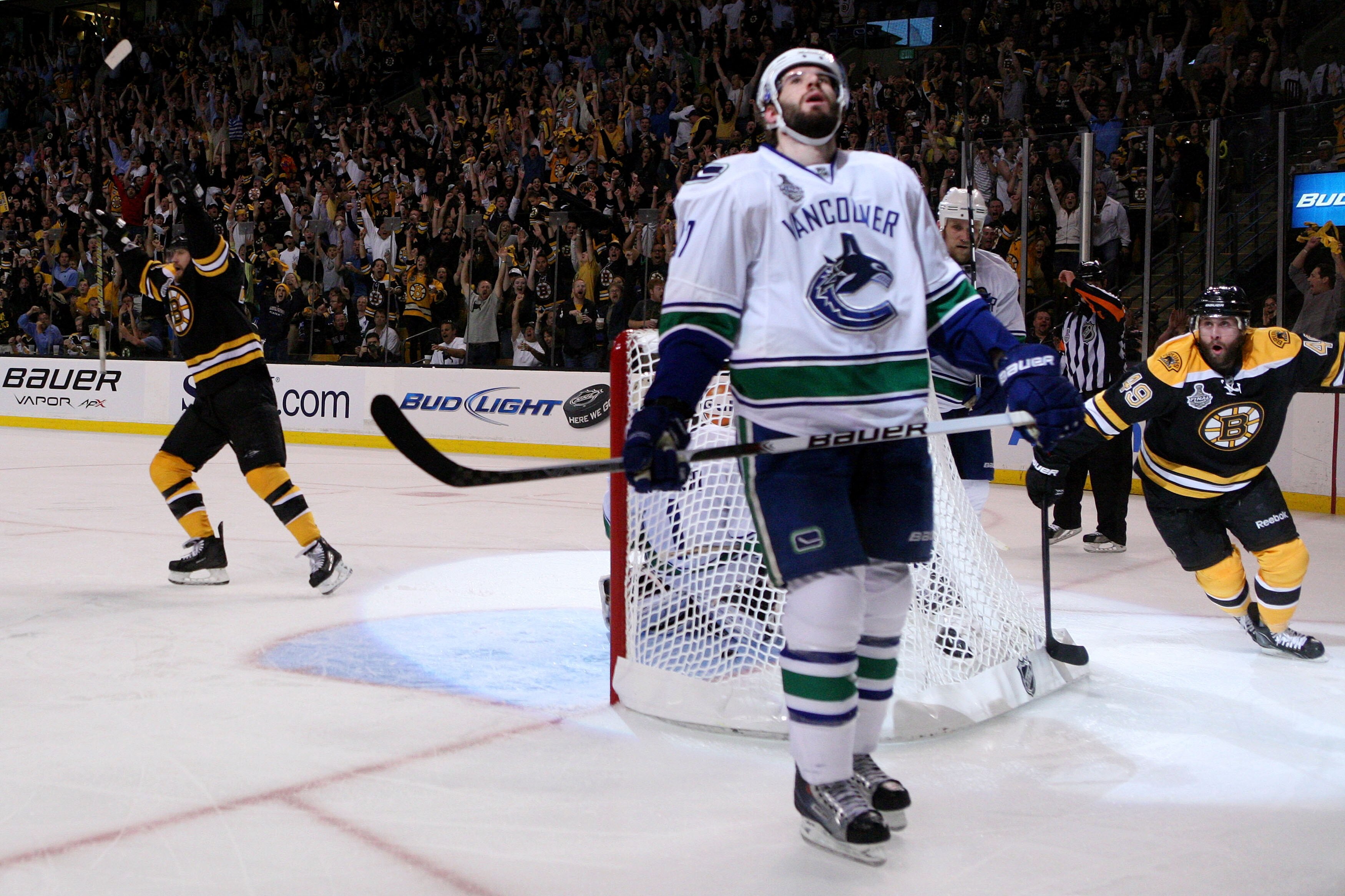 BOSTON, MA - JUNE 06:  Rich Peverley #49 of the Boston Bruins celebrates past Ryan Kesler #17 of the Vancouver Canucks after Mark Recchi (not pictured) #28 scored a goal in the second period against Roberto Luongo #1 of the Vancouver Canucks during Game T