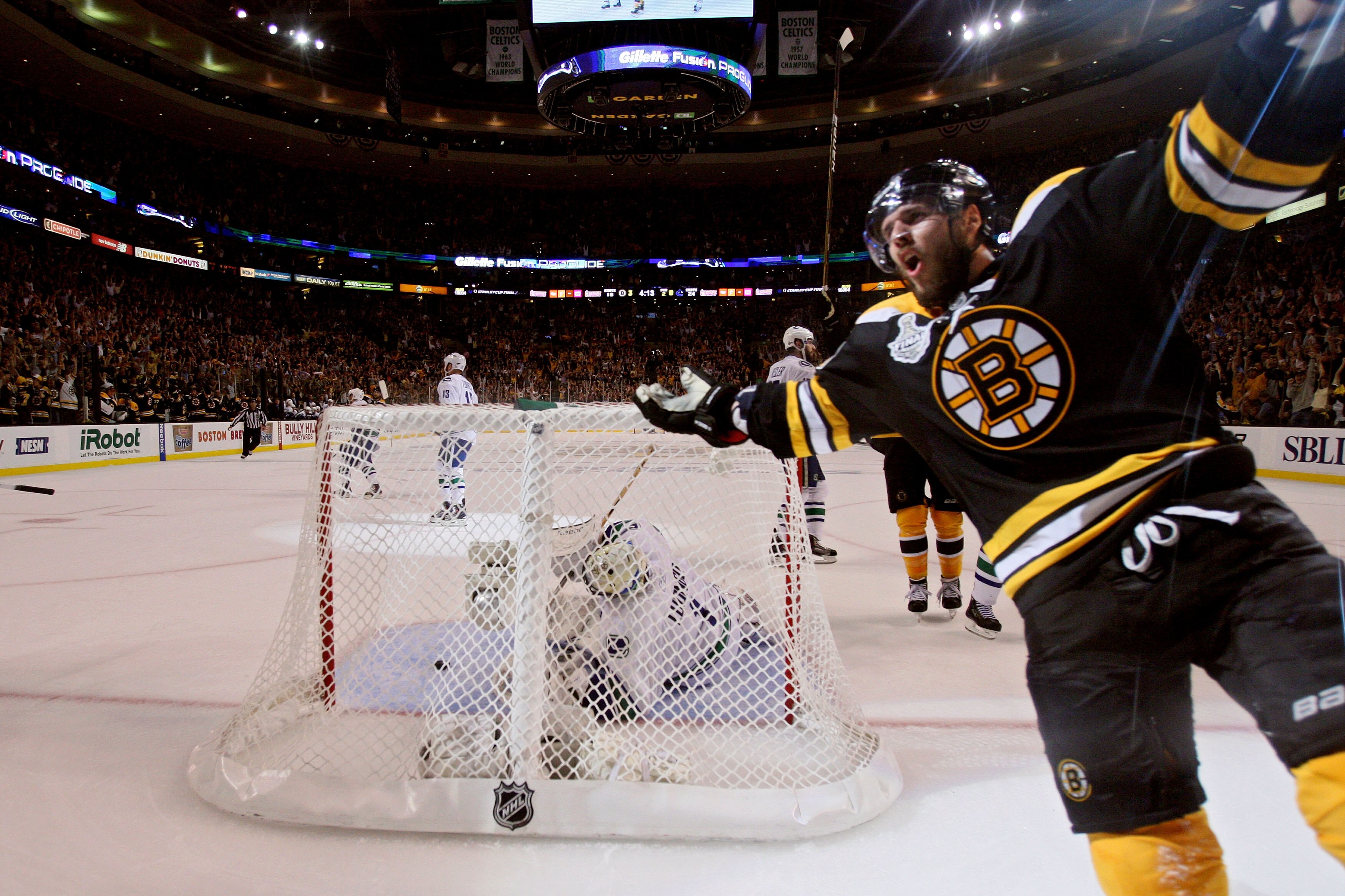 BOSTON, MA - JUNE 06:  David Krejci #46 of the Boston Bruins celebrates after a goal against Roberto Luongo #1 of the Vancouver Canucks during Game Three of the 2011 NHL Stanley Cup Final at TD Garden on June 6, 2011 in Boston, Massachusetts.  (Photo by B