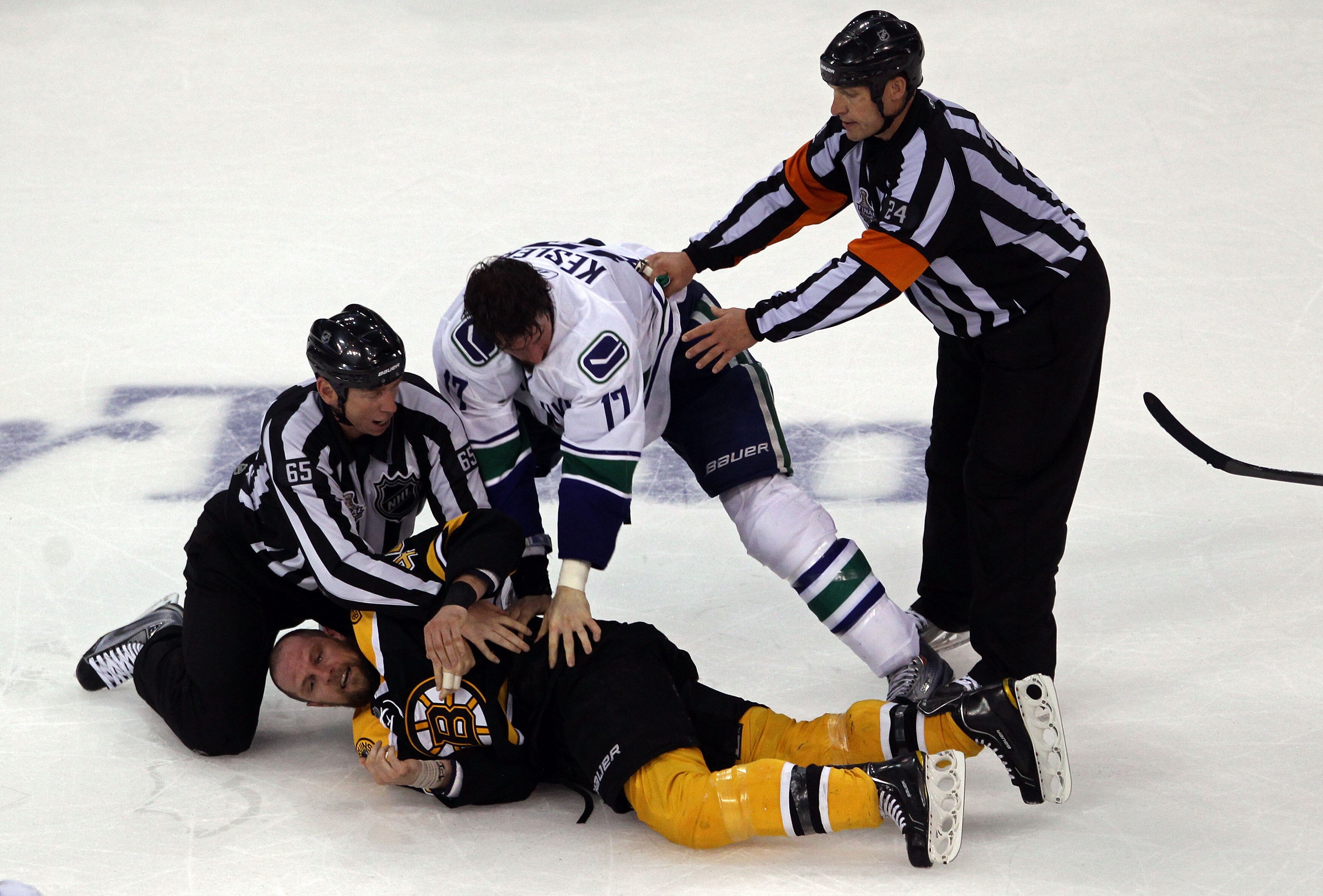 BOSTON, MA - JUNE 06:  Ryan Kesler #17 of the Vancouver Canucks fights with Dennis Seidenberg #44 of the Boston Bruins during Game Three of the 2011 NHL Stanley Cup Final at TD Garden on June 6, 2011 in Boston, Massachusetts.  (Photo by Bruce Bennett/Gett