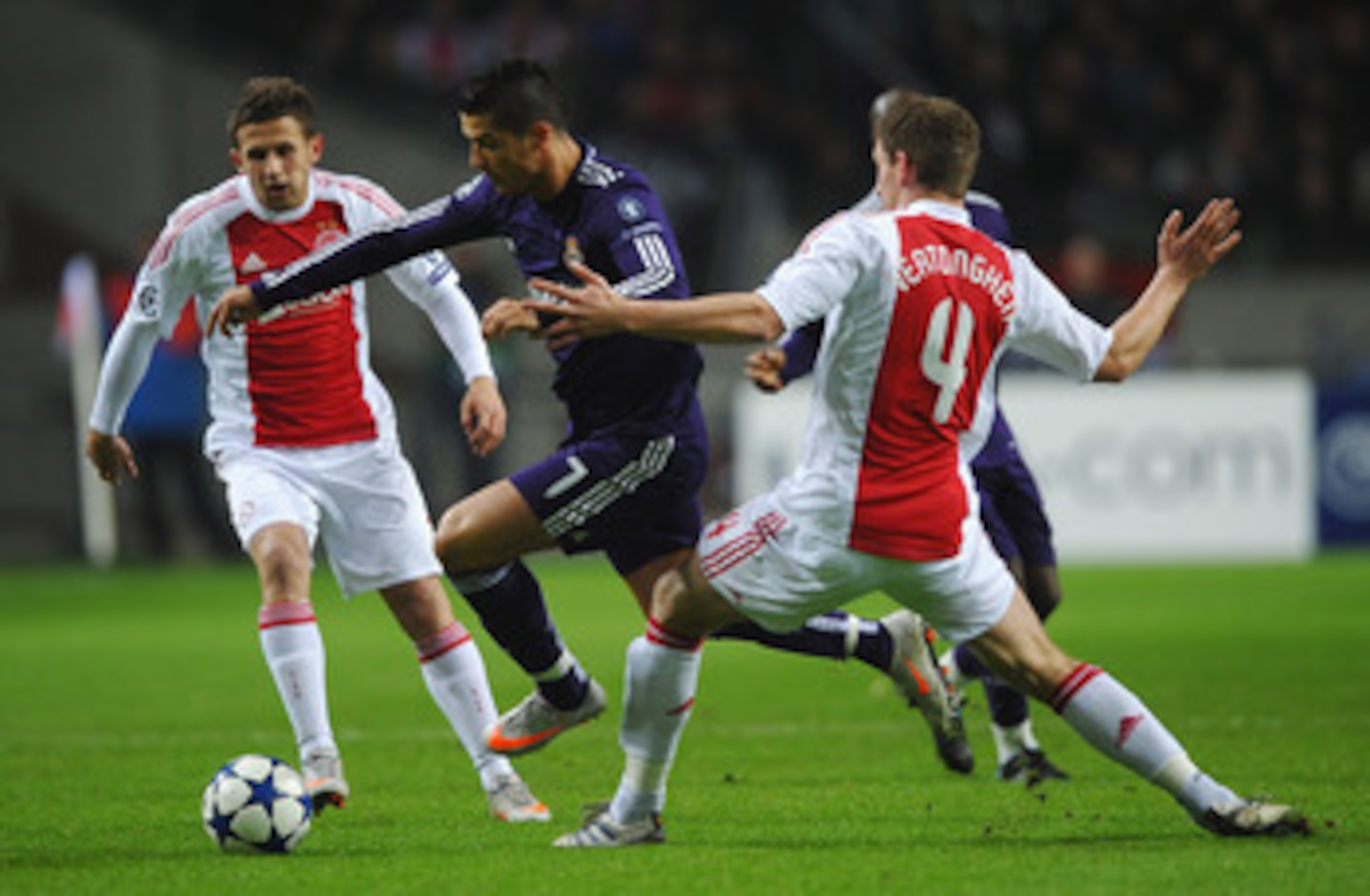 AMSTERDAM, NETHERLANDS - NOVEMBER 23:  Cristiano Ronaldo of Real Madrid battles for the ball with Jan Vertonghen of Ajax during the UEFA Champions League Group G match between AFC Ajax and Real Madrid at the Ajax Arena on November 23, 2010 in Amsterdam, N