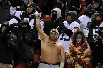EAST RUTHERFORD, NJ - JANUARY 03:  A fan goes shirtless despite cold temperatures while cheering  during the game between the New York Jets and the Cincinnati Bengals at Giants Stadium on January 3, 2010 in East Rutherford, New Jersey. The game was the la