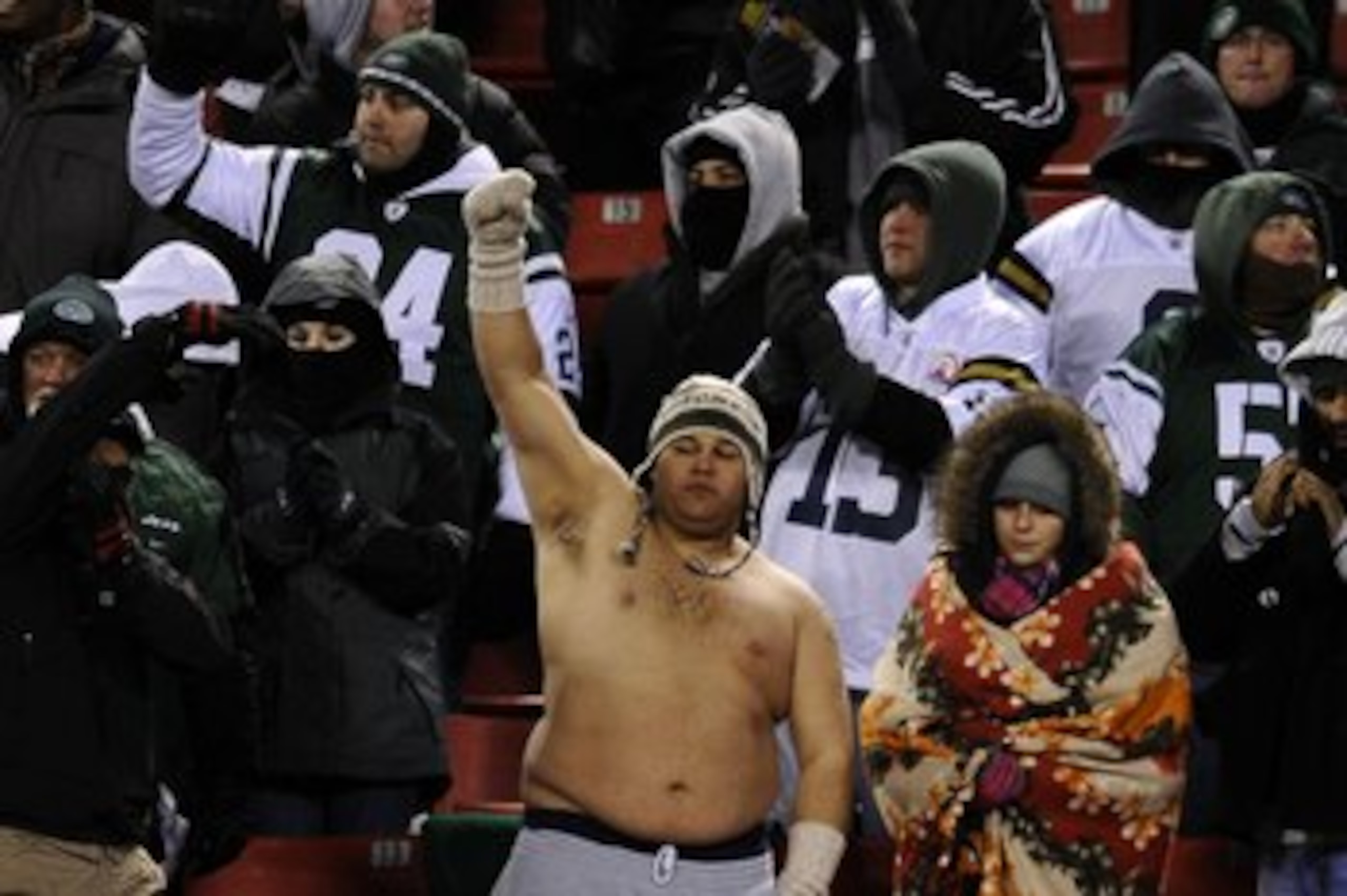 EAST RUTHERFORD, NJ - JANUARY 03:  A fan goes shirtless despite cold temperatures while cheering  during the game between the New York Jets and the Cincinnati Bengals at Giants Stadium on January 3, 2010 in East Rutherford, New Jersey. The game was the la