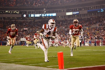 CHARLOTTE, NC - DECEMBER 04:  David Wilson #4 of the Virginia Tech Hokies runs for a touchdown during their game against the Florida State Seminoles at Bank of America Stadium on December 4, 2010 in Charlotte, North Carolina.  (Photo by Streeter Lecka/Get