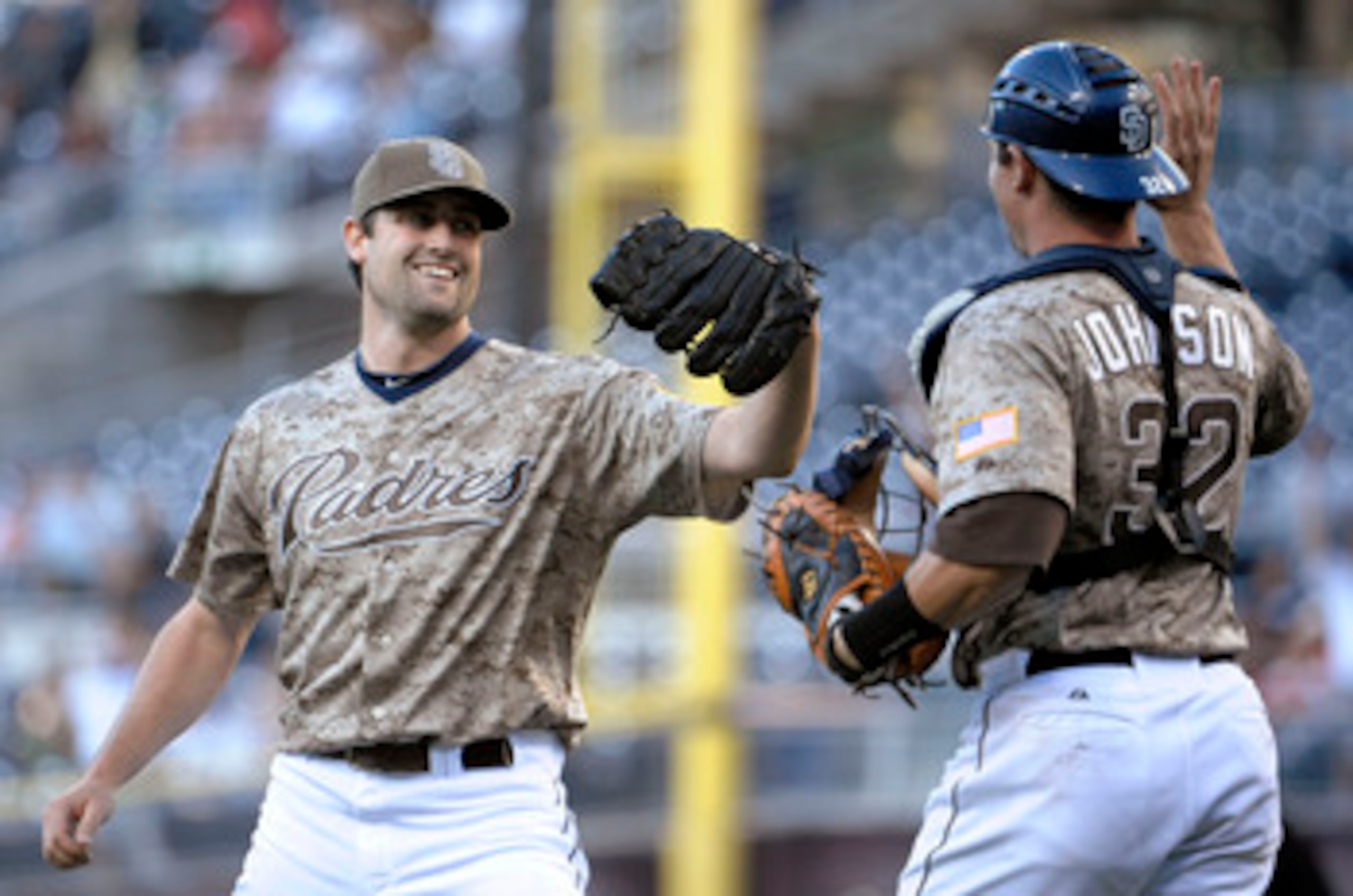 SAN DIEGO, CA - JUNE 5: Pat Neshek #34 of the San Diego Padres, left, is congratulated by catcher Rob Johnson after the final out in the ninth inning of a baseball game against the Houston Astros at Petco Park on June 5, 2011 in San Diego, California. The