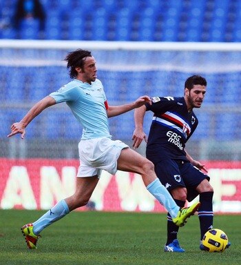 ROME, ITALY - JANUARY 16:  Stefano Mauri of SS Lazio competes for the ball with Pietro Accardi (R) of UC Sampdoria during the Serie A match between SS Lazio and UC Sampdoria at Stadio Olimpico on January 16, 2011 in Rome, Italy.  (Photo by Paolo Bruno/Get