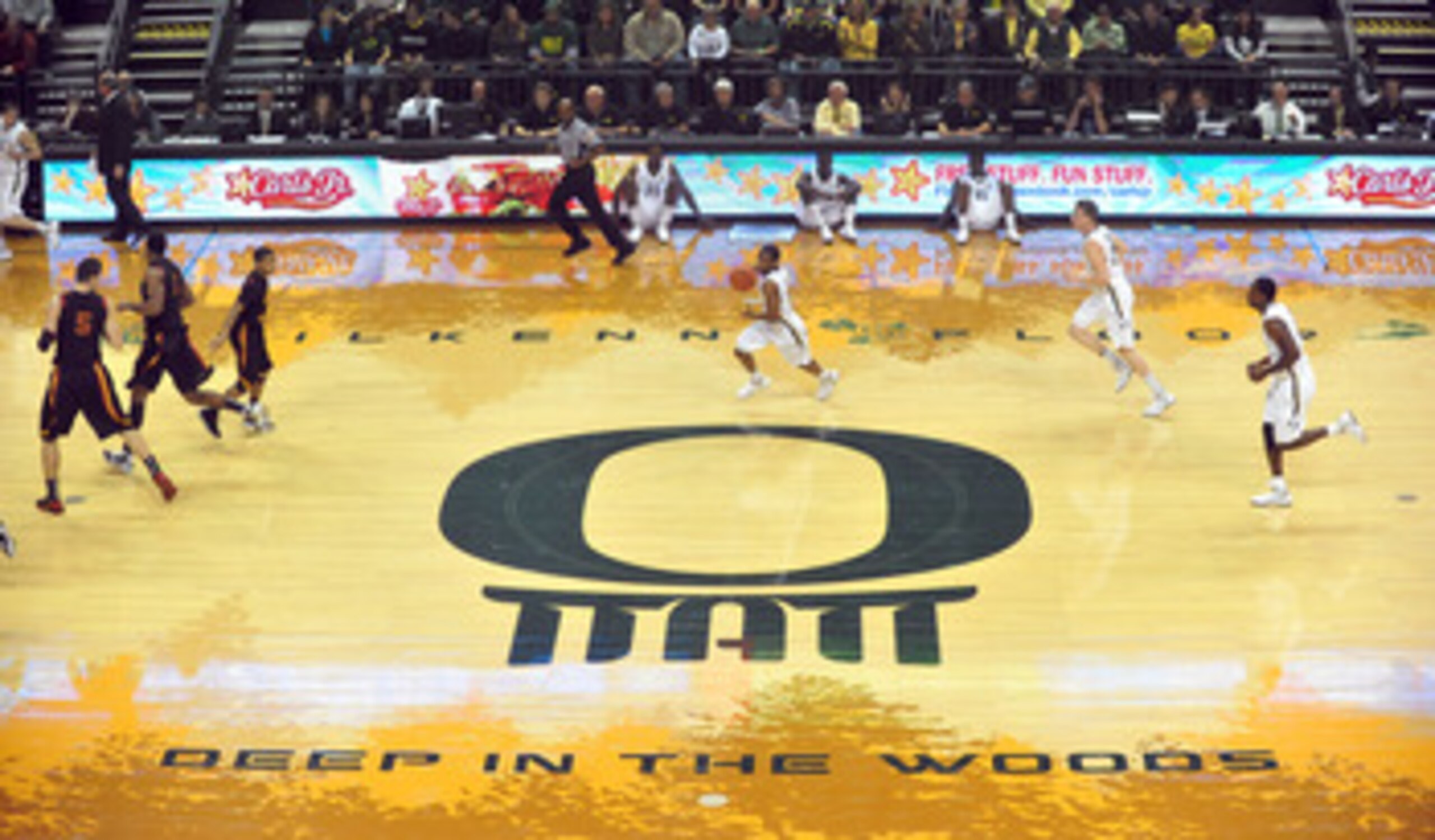 EUGENE, OR - JANUARY 13: The Oregon Ducks bring the ball up the court in the first half of the game against the USC Trojans at Matt Court on January 13, 2011 in Eugene, Oregon. The arena is named  co-founder and Chairman of Nike, Inc., Phil Knight's son, 
