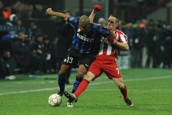 MILAN, ITALY - FEBRUARY 23:  Douglas Maicon of Inter Milan is challenged by Franck Ribery of FC Bayern Muenchen during the UEFA Champions League round of 16 first leg match between Inter Milan v FC Bayern Muenchen on February 23, 2011 in Milan, Italy.  (P