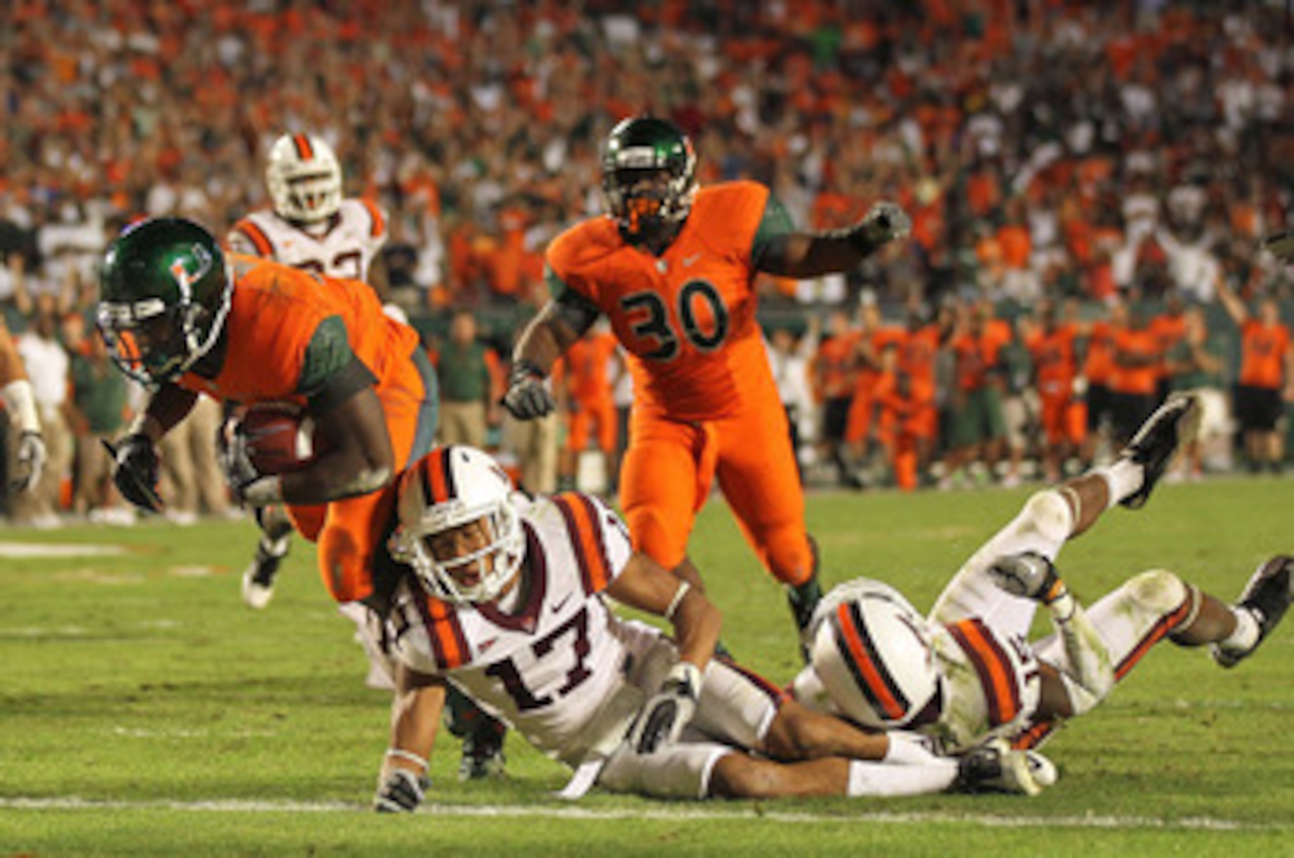 MIAMI - NOVEMBER 20: Lamar Miller #6 of the Miami Hurricanes runs for a touchdown during a game against the Virginia Tech Hokies at Sun Life Stadium on November 20, 2010 in Miami, Florida.  (Photo by Mike Ehrmann/Getty Images)