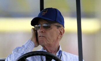 PORT ST. LUCIE, FL - FEBRUARY 17:  Owner Fred Wilpon of the New York Mets talks on the phone during spring training at Tradition Field on February 17, 2011 in Port St. Lucie, Florida.  (Photo by Marc Serota/Getty Images)