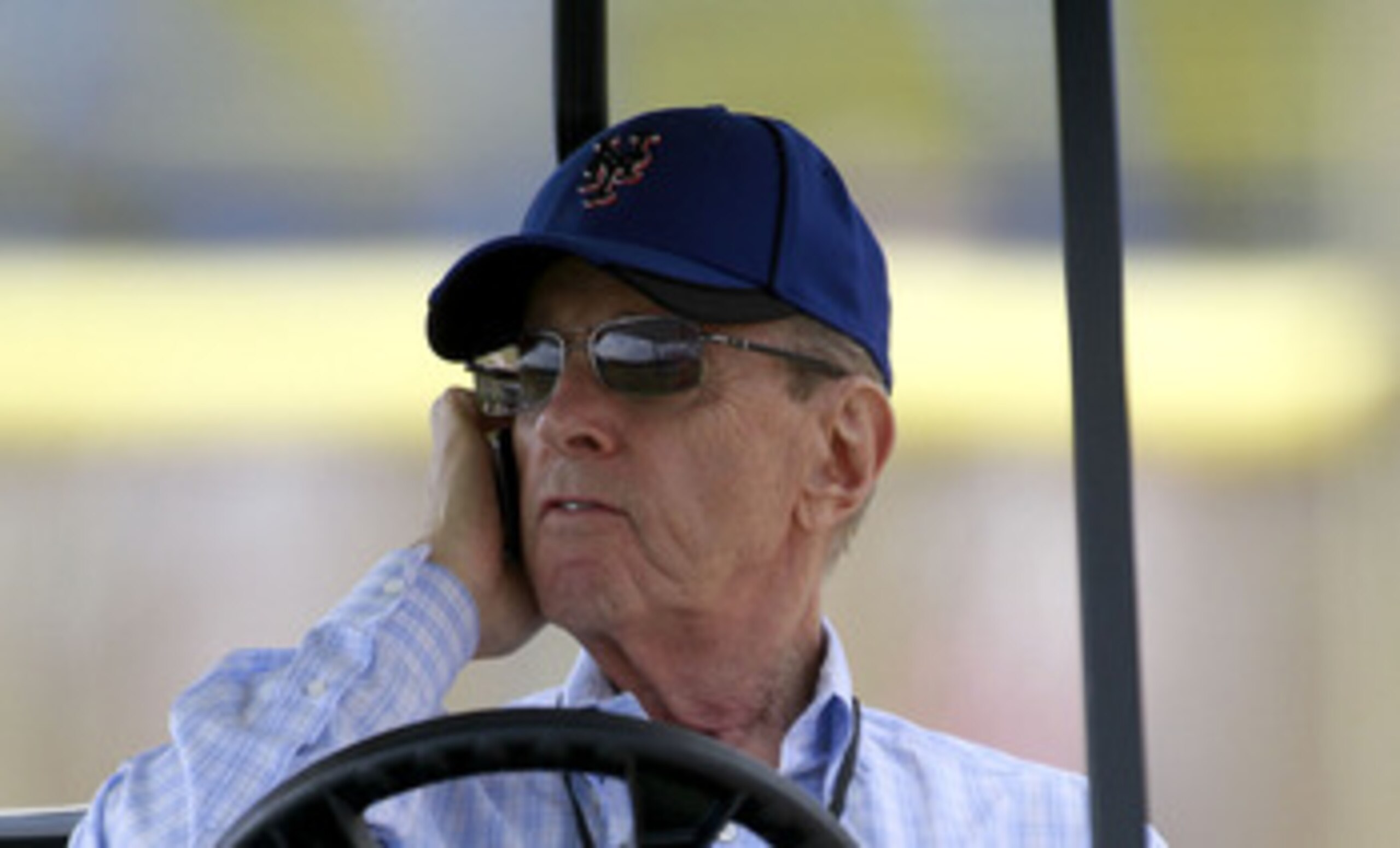 PORT ST. LUCIE, FL - FEBRUARY 17:  Owner Fred Wilpon of the New York Mets talks on the phone during spring training at Tradition Field on February 17, 2011 in Port St. Lucie, Florida.  (Photo by Marc Serota/Getty Images)