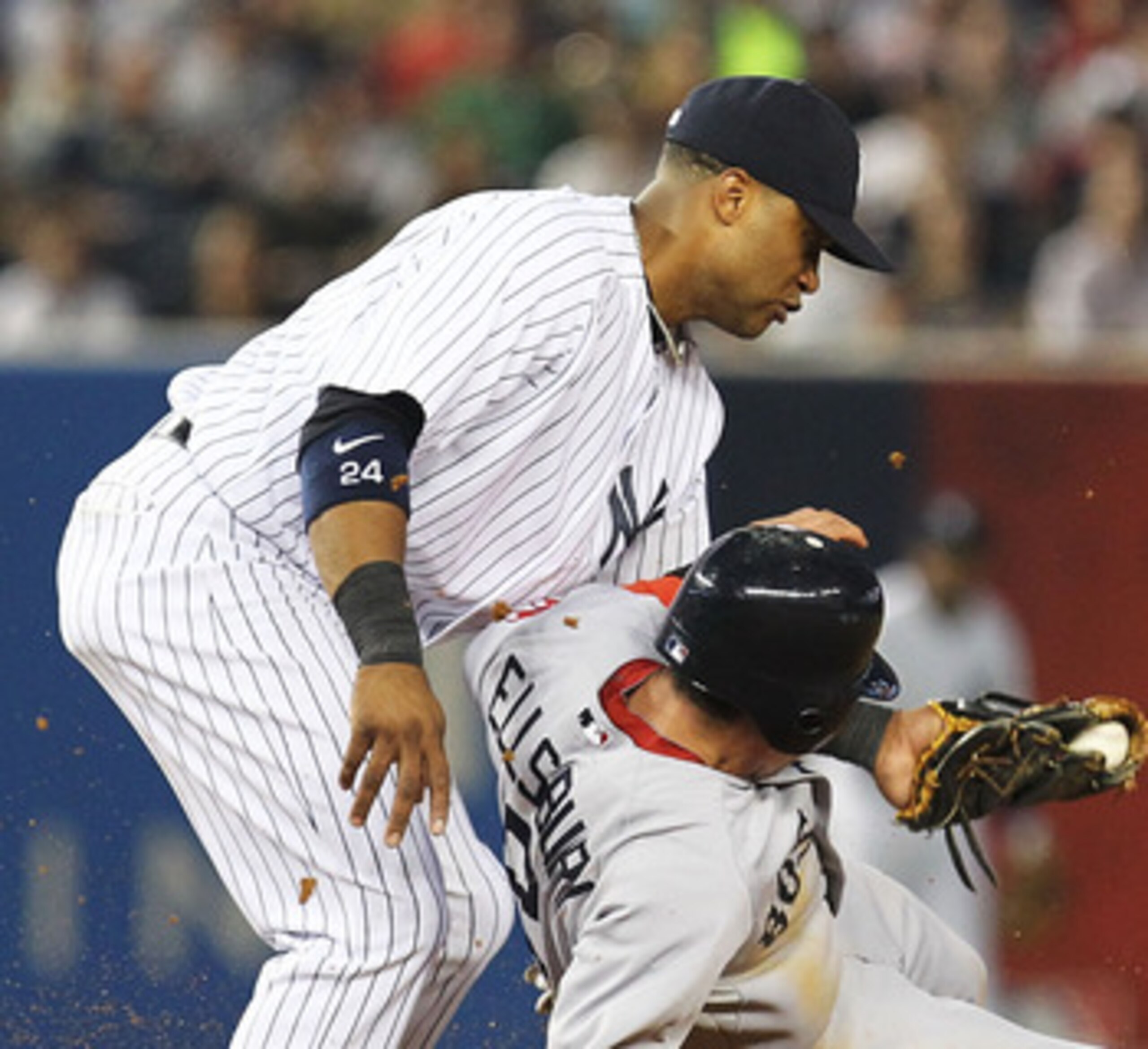 NEW YORK, NY - JUNE 07:  Robinson Cano #24 of the New York Yankees tags out Jacoby Ellsbury #2 of the Boston Red Sox on a steal attempt during their game on June 7, 2011 at Yankee Stadium in the Bronx borough of New York City.  (Photo by Al Bello/Getty Im