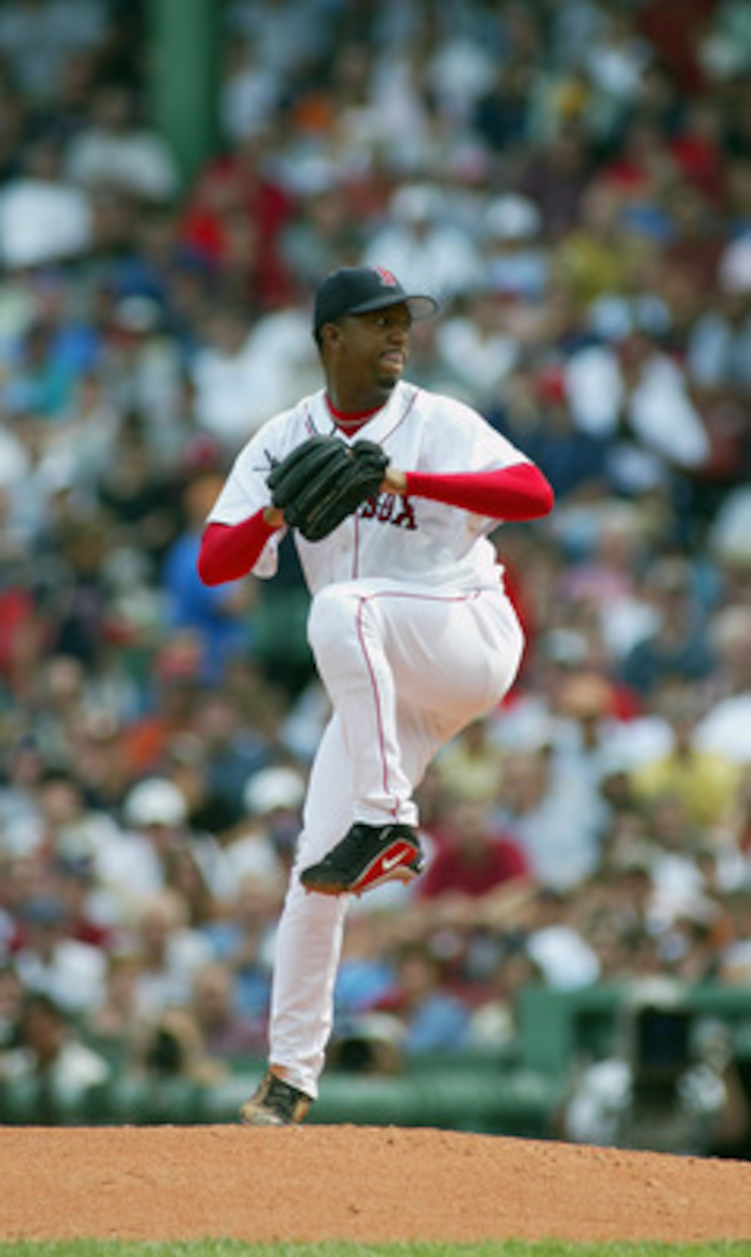 BOSTON, MA - AUGUST 30:  Pedro Martinez #45 of the Boston Red Sox winds up for the pitch during the game against the New York Yankees at Fenway Park on August 30, 2003  in Boston, Massachusetts. The Yankees won 10-7.  (Photo by Rick Stewart/Getty Images)