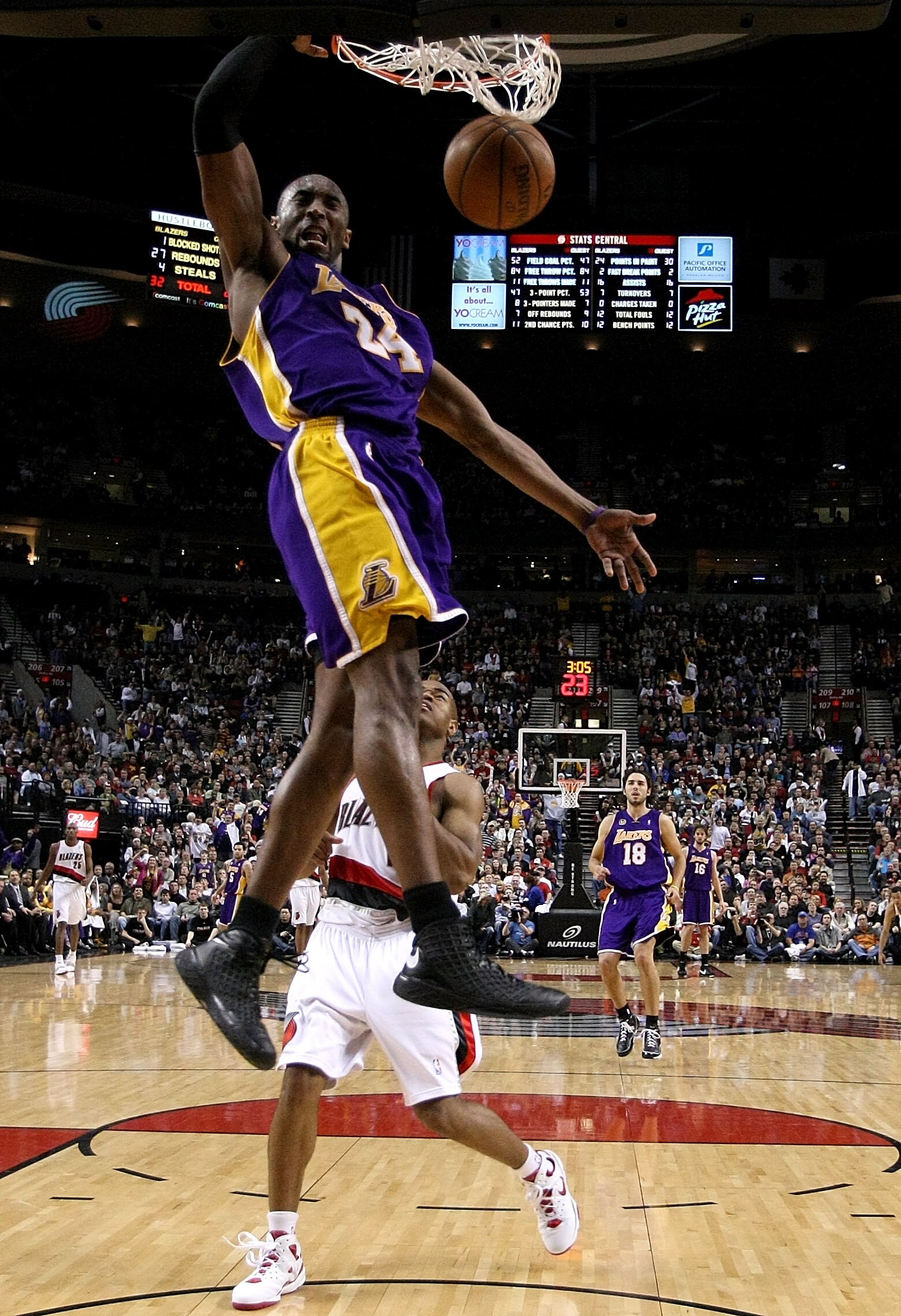 PORTLAND, OR - APRIL 08:  Kobe Bryant #24 of the Los Angeles Lakers dunks the ball over Jarrett Jack #1 the Portland Trail Blazers at the Rose Garden on April 8, 2008 in Portland, Oregon.  NOTE TO USER: User expressly acknowledges and agrees that, by down
