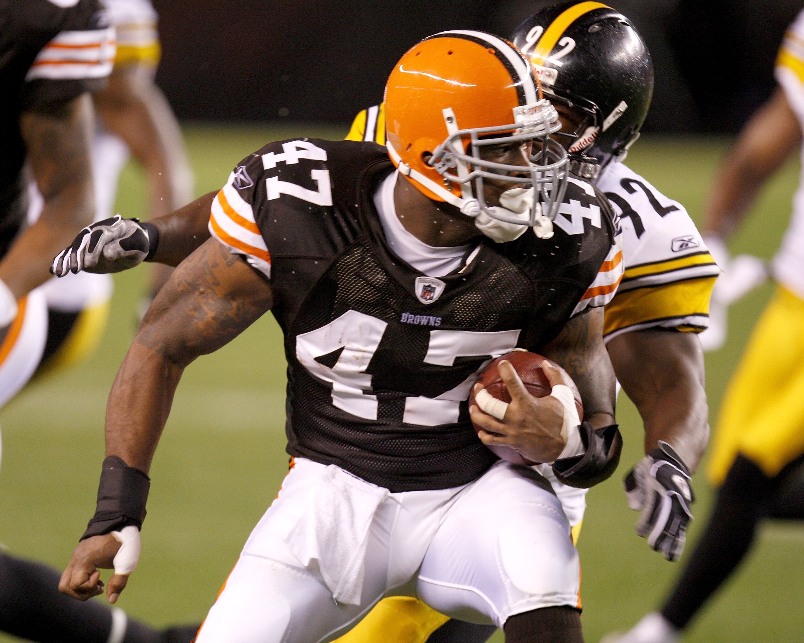 CLEVELAND - SEPTEMBER 14: Lawrence Vickers #47 of the Cleveland Browns tries to get around James Harrison #92 of the Pittsburgh Steelers during a first quarter  on September 14, 2008 at Cleveland Browns Stadium in Cleveland, Ohio.  (Photo by Gregory Shamu