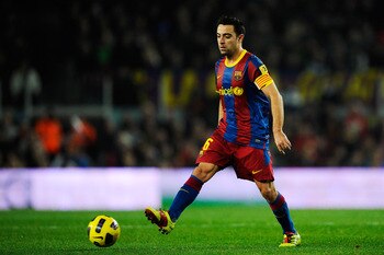 BARCELONA, SPAIN - JANUARY 02:  Xavi Hernandez of Barcelona passes the ball during the La Liga match between Barcelona and Levante UD at Camp Nou on January 2, 2011 in Barcelona, Spain. Barcelona won 2-1. Xavi Hernandez is set to make Barcelona history af