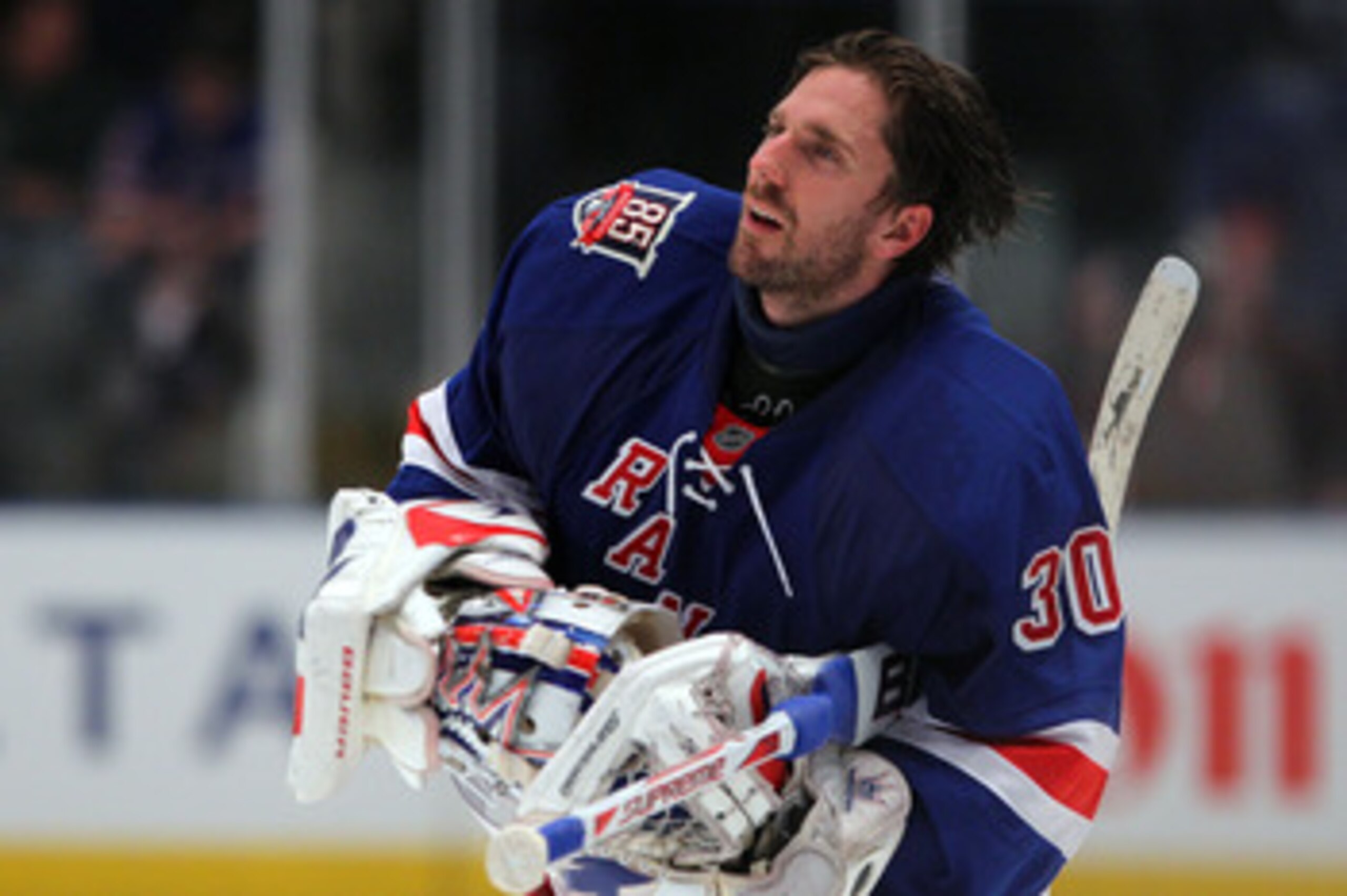 NEW YORK, NY - APRIL 20:  Goalie Henrik Lundqvist #30 of the New York Rangers skates towards the net with his helmet off against the Washington Capitals in Game Four of the Eastern Conference Quarterfinals during the 2011 NHL Stanley Cup Playoffs at Madis