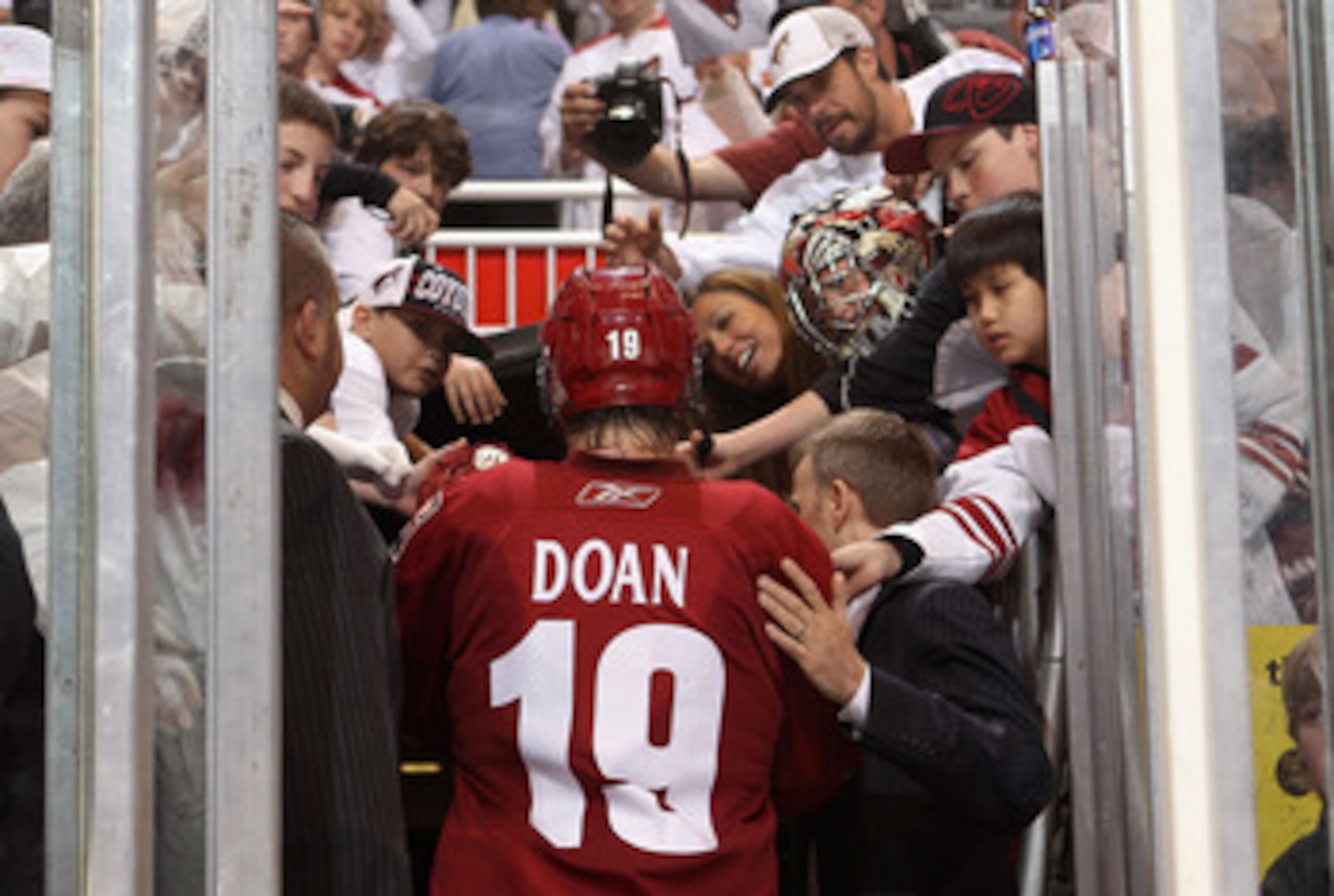 GLENDALE, AZ - APRIL 20:  Shane Doan #19 of the Phoenix Coyotes walks off the ice after being defeated by the Detroit Red Wings in Game Four of the Western Conference Quarterfinals during the 2011 NHL Stanley Cup Playoffs at Jobing.com Arena on April 20, 