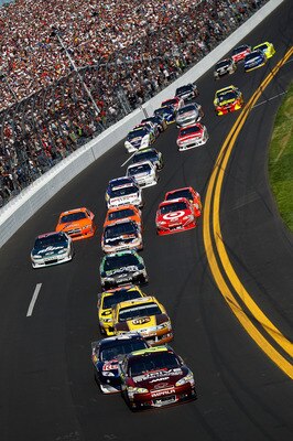 DAYTONA BEACH, FL - FEBRUARY 20:  Jeff Gordon, driver of the #24 Drive to End Hunger Chevrolet, leads a pack of cars during the NASCAR Sprint Cup Series Daytona 500 at Daytona International Speedway on February 20, 2011 in Daytona Beach, Florida.  (Photo 