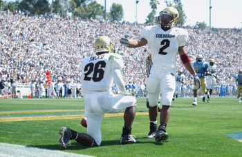 PASADENA, CA - SEPTEMBER 21:  Defensive back Roderick Sneed #26 of the Colorado Buffaloes takes the advice of running back Brian Calhoun #2 and takes the touchback during the NCAA football game against the UCLA Bruins on September 21, 2002 at the Rose Bow