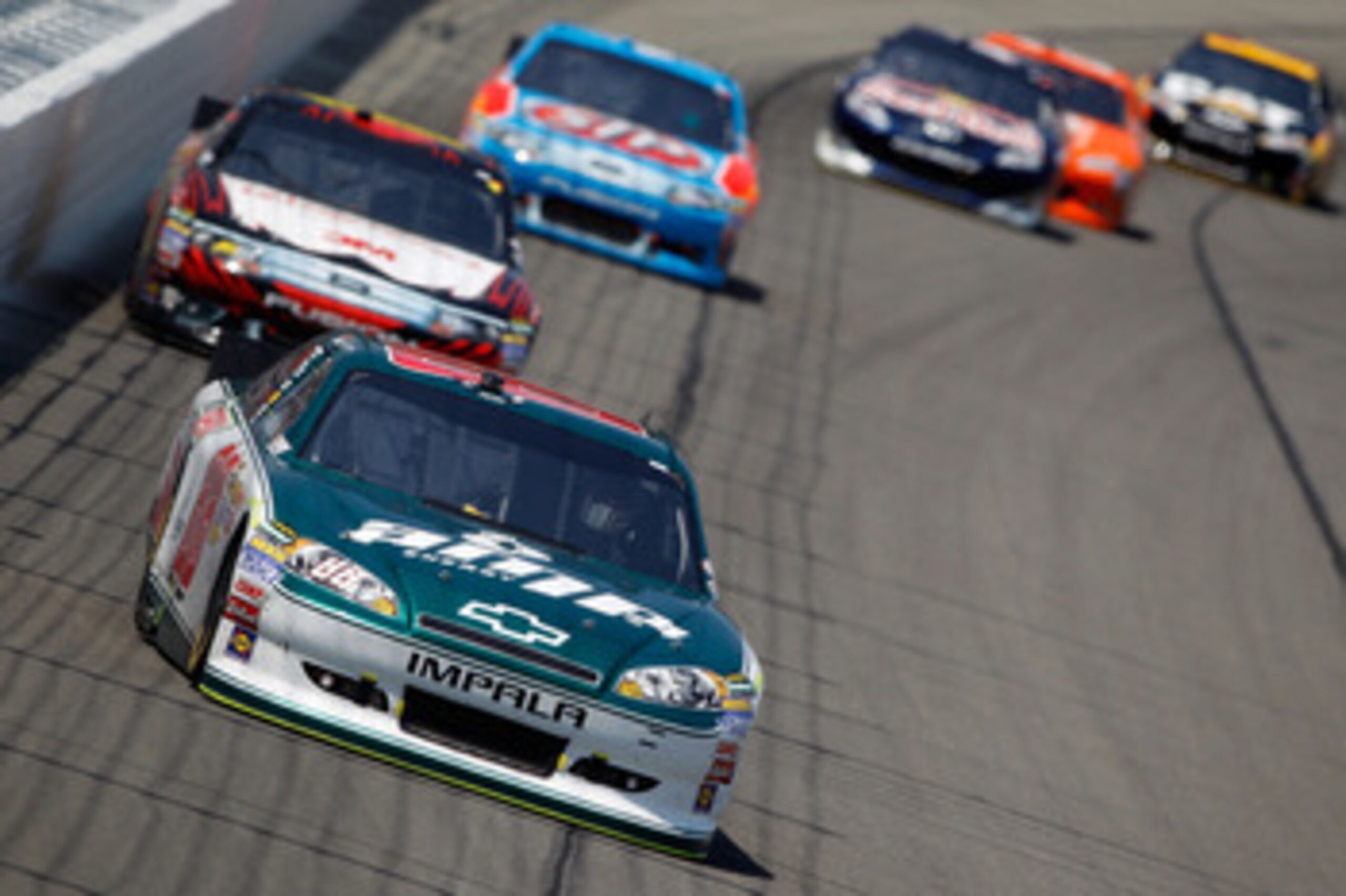 KANSAS CITY, KS - JUNE 05:  Dale Earnhardt Jr., driver of the #88 Amp Energy/National Guard Chevrolet, leads a group of cars during the NASCAR Sprint Cup Series STP 400 at Kansas Speedway on June 5, 2011 in Kansas City, Kansas.  (Photo by Todd Warshaw/Get