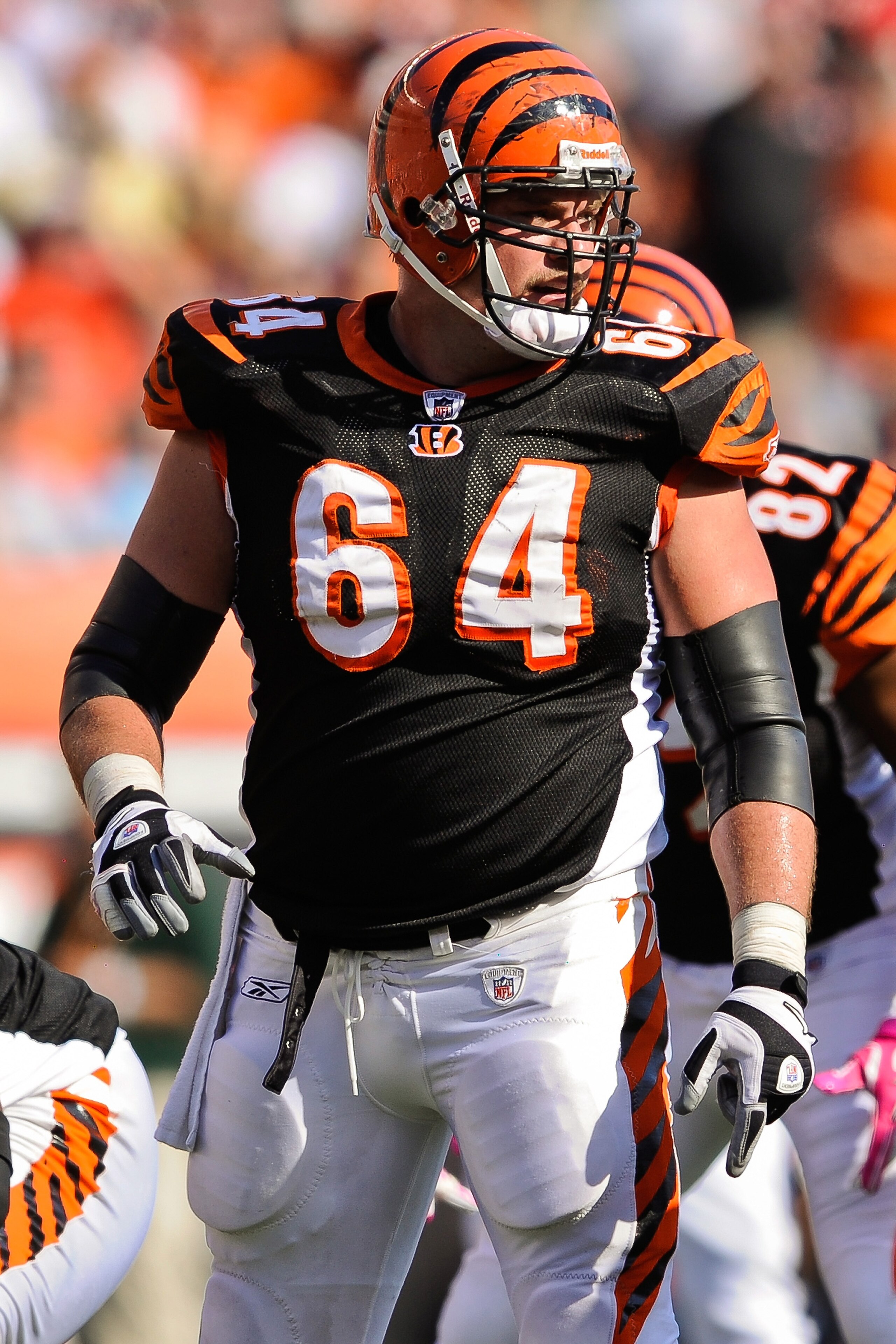 CINCINNATI, OH - OCTOBER 10: Center Kyle Cook #64 gets ready to snap the ball against the Tampa Bay Buccaneers at Paul Brown Stadium on October 10, 2010 in Cincinnati, Ohio. (Photo by Jamie Sabau/Getty Images)